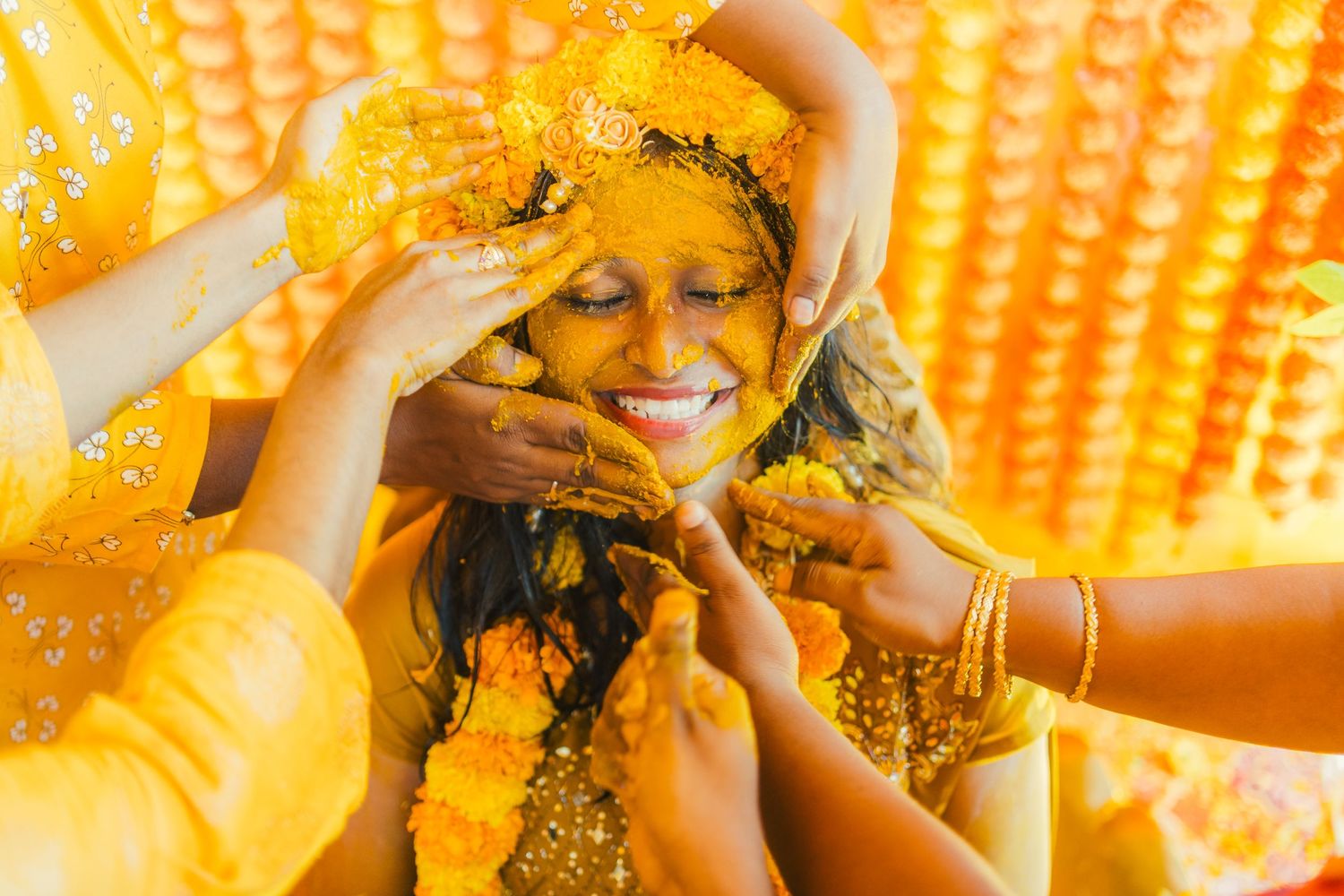 Traditional Indian pre-wedding Haldi ceremony with yellow turmeric decoration.