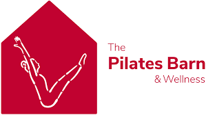 Red house-shaped logo for The Pilates Barn & Wellness featuring a white figure in a stretching pose.