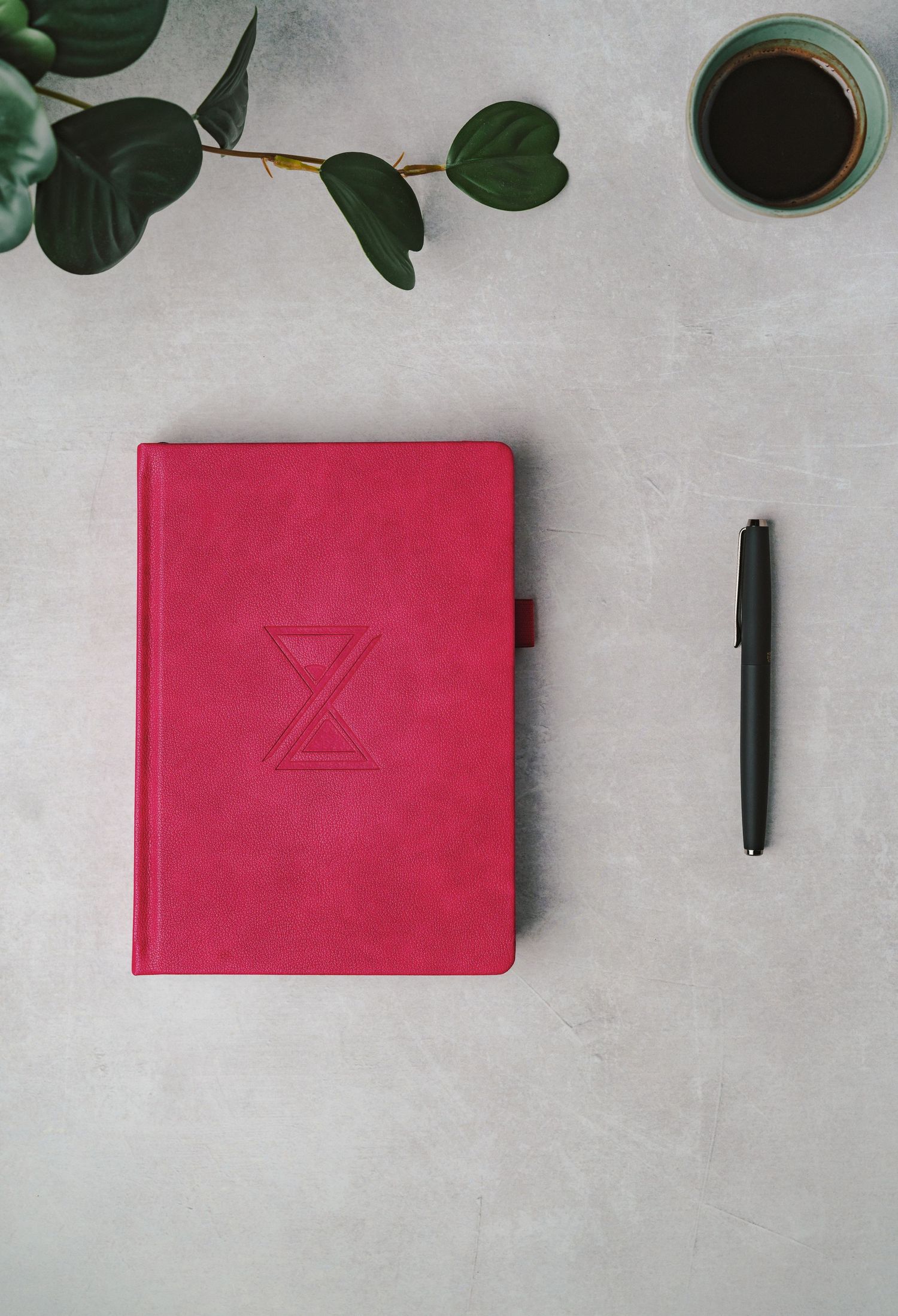 Pink journal and pen. Product photography