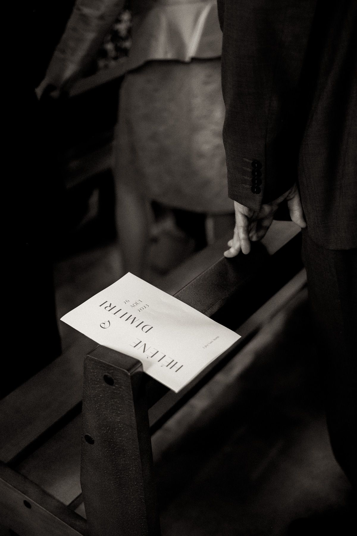 Black and white artistic photograph of paper notes in shadows creating a moody atmospheric composition.