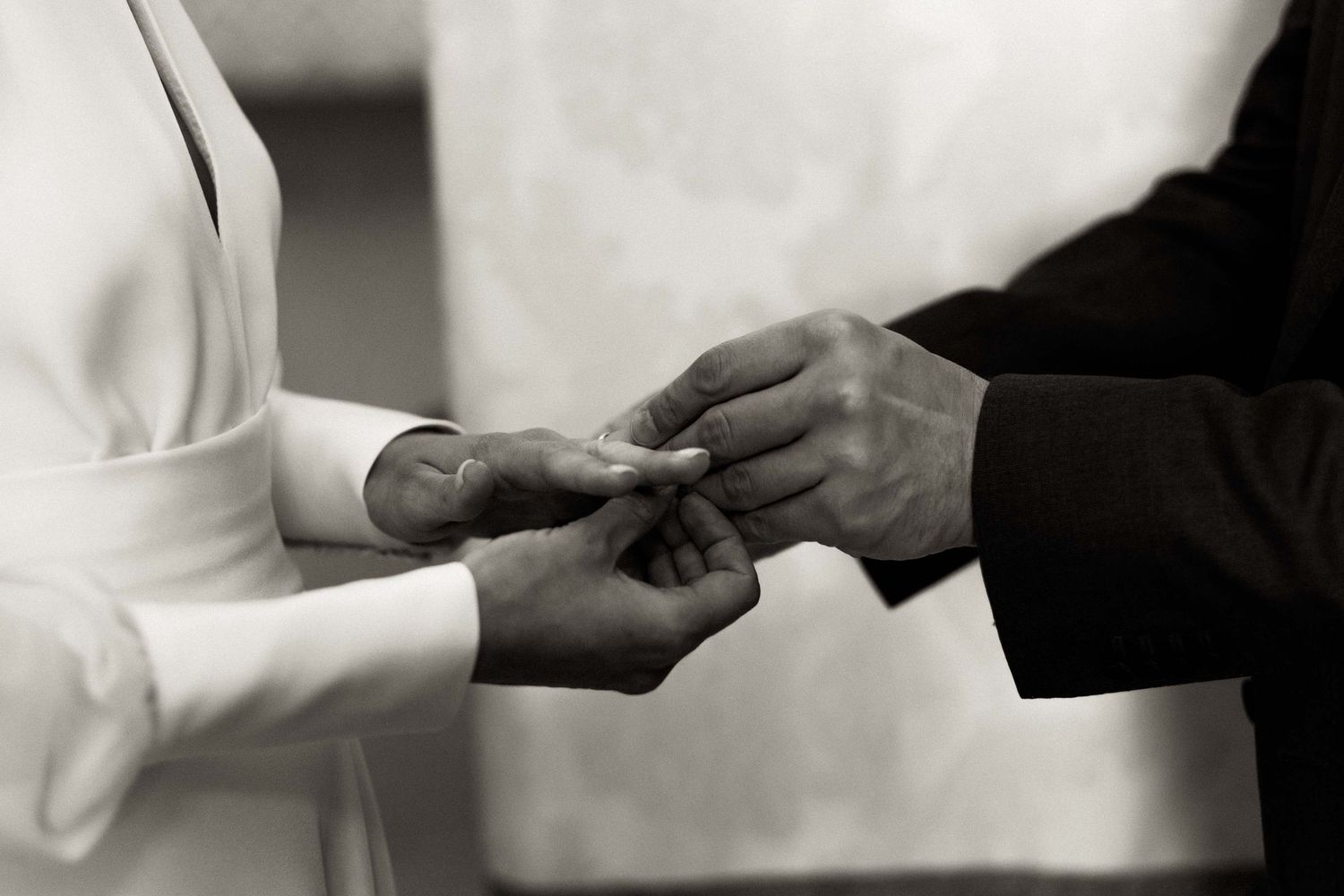 Black and white photo sequence showing hands exchanging business cards in a formal professional setting.