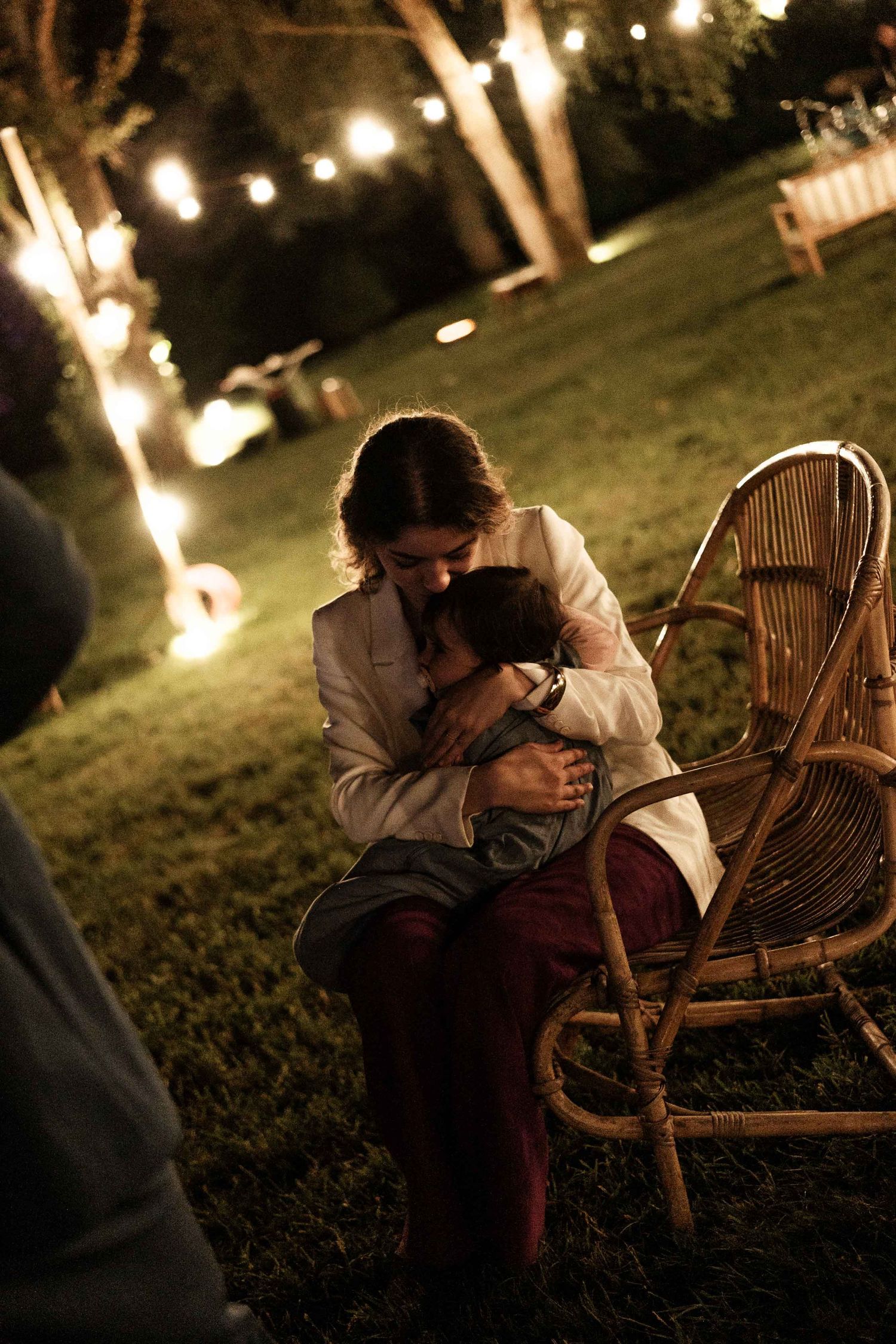 A romantic evening scene on a rattan chair with soft lighting and bokeh effects in the background.