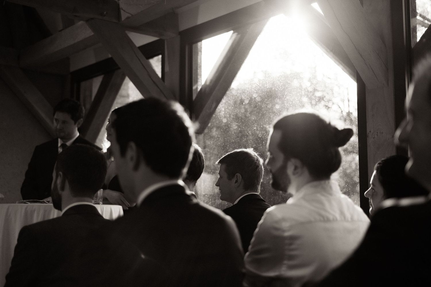 Black and white photos show people dancing and celebrating at what appears to be a wedding reception or party.