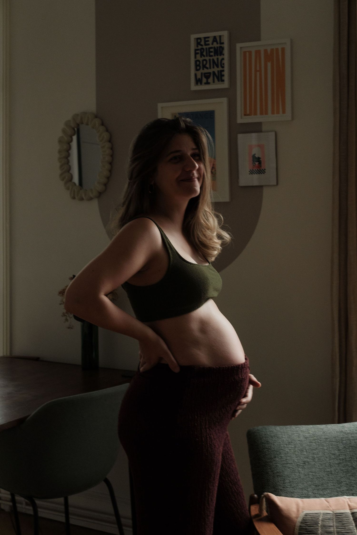 A series of moody boudoir photographs showing a figure in silhouette against window light in a dimly lit room.