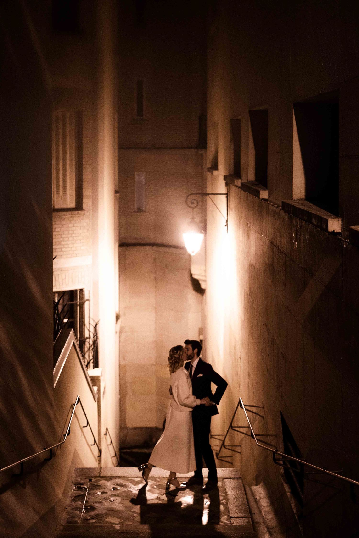 Dramatic black and white sequence showing silhouettes of a couple in a dimly lit hallway creating moody atmosphere.