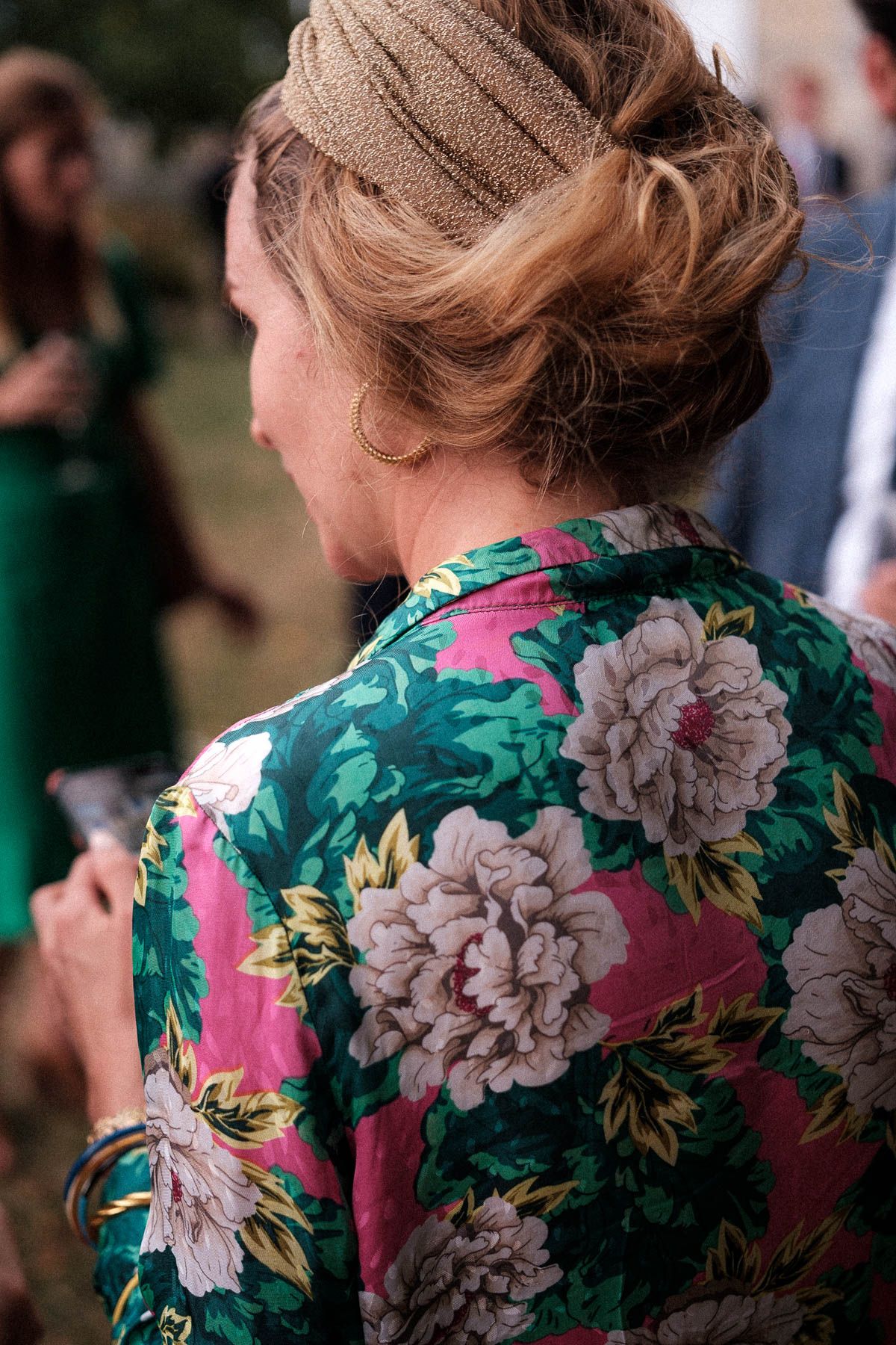 Close-up views of a floral dress with pink, green and gray blooms in a vintage-inspired pattern.