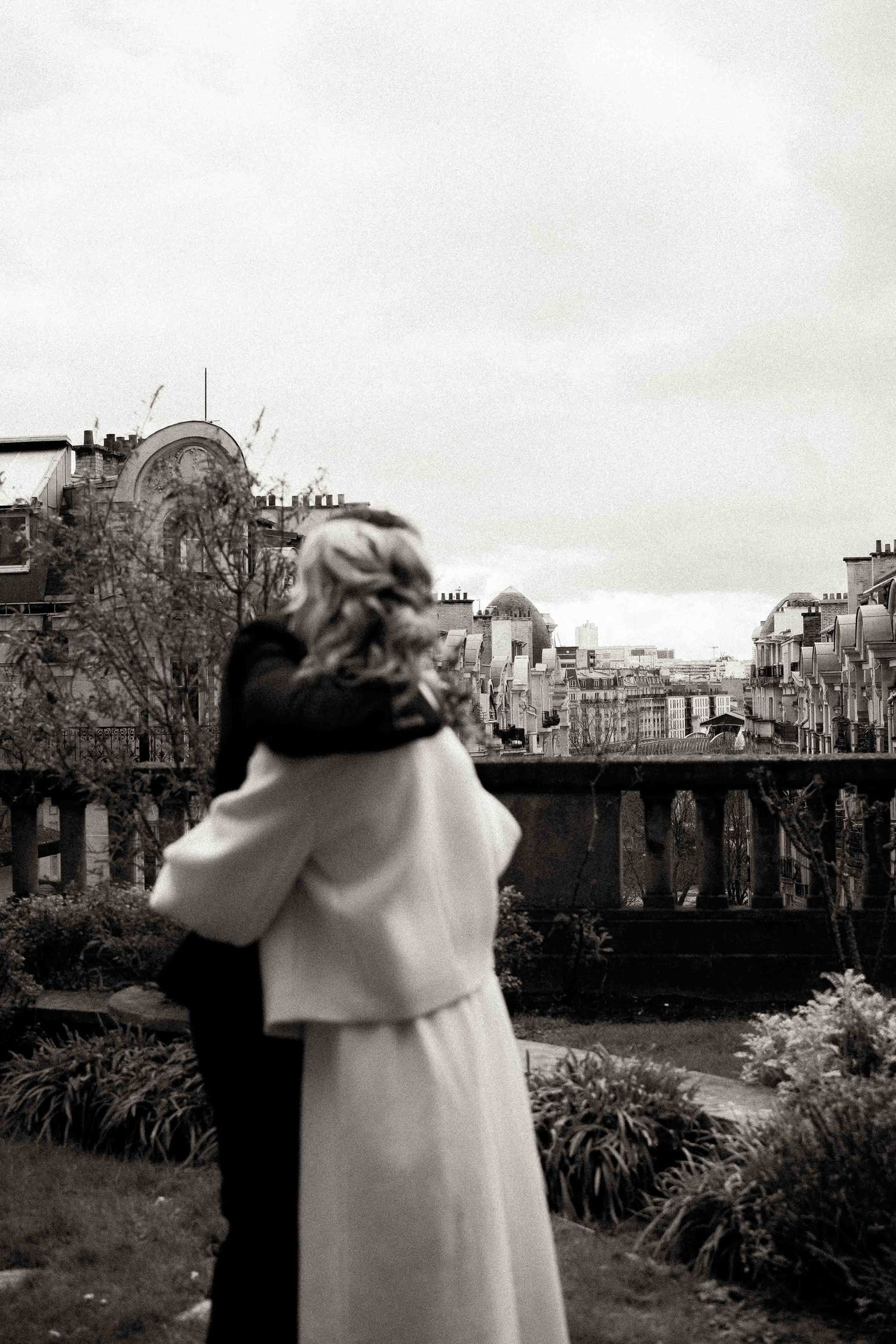 A series of black and white photos showing a person in a light coat looking out at an urban cityscape.