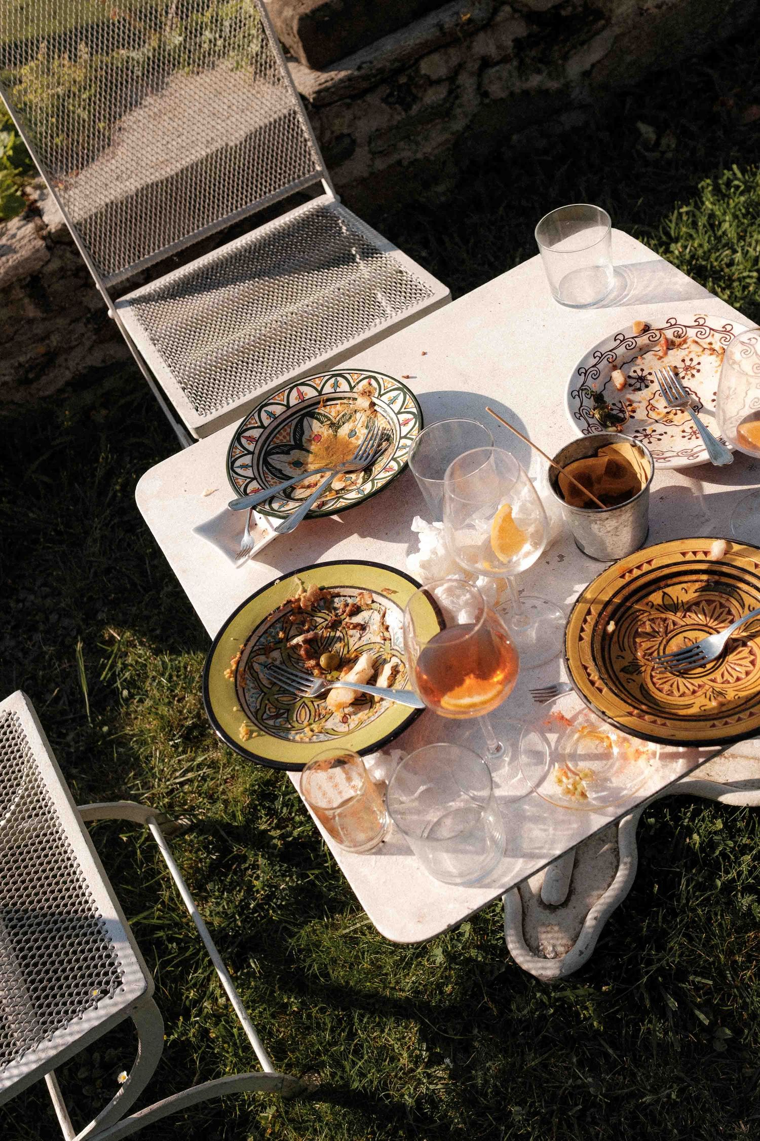 A sequence of photos showing decorative plates being broken in a sunlit outdoor setting.