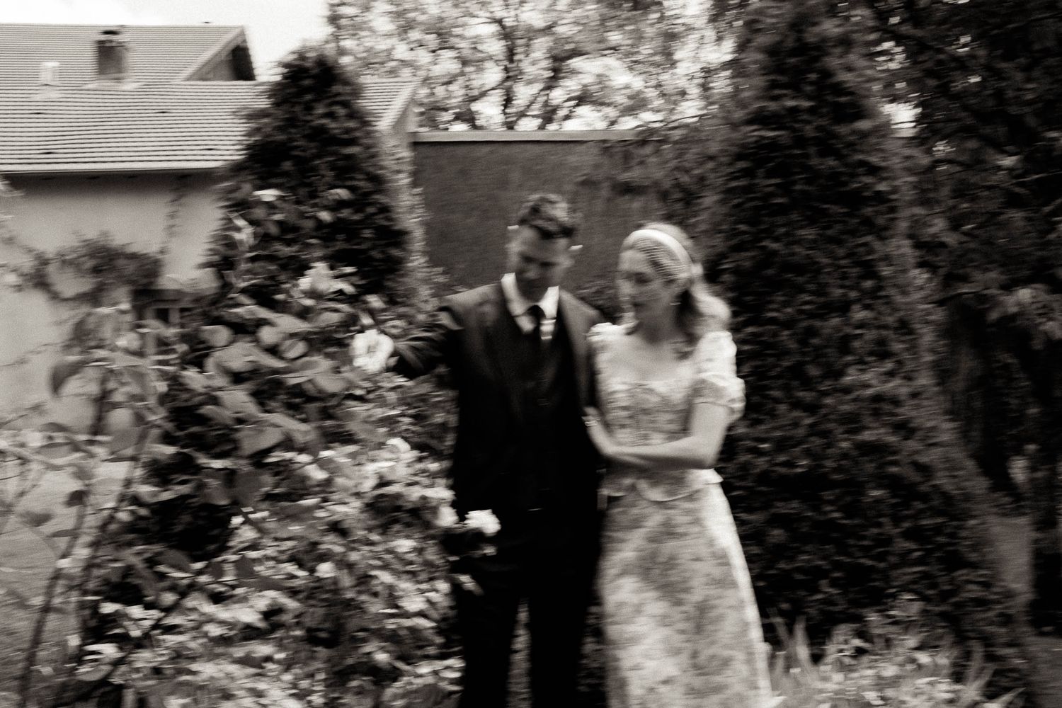 A collection of vintage black and white wedding photographs displayed in a row showing couples in gardens and outdoor settings.