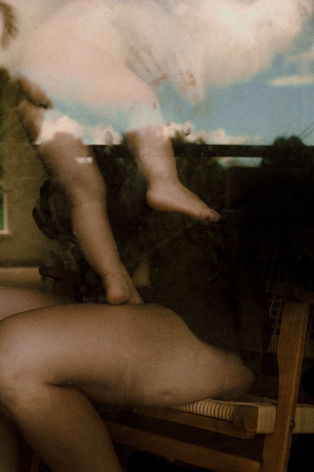 A blurred and abstract series of dark photographs showing indistinct forms against a light background.