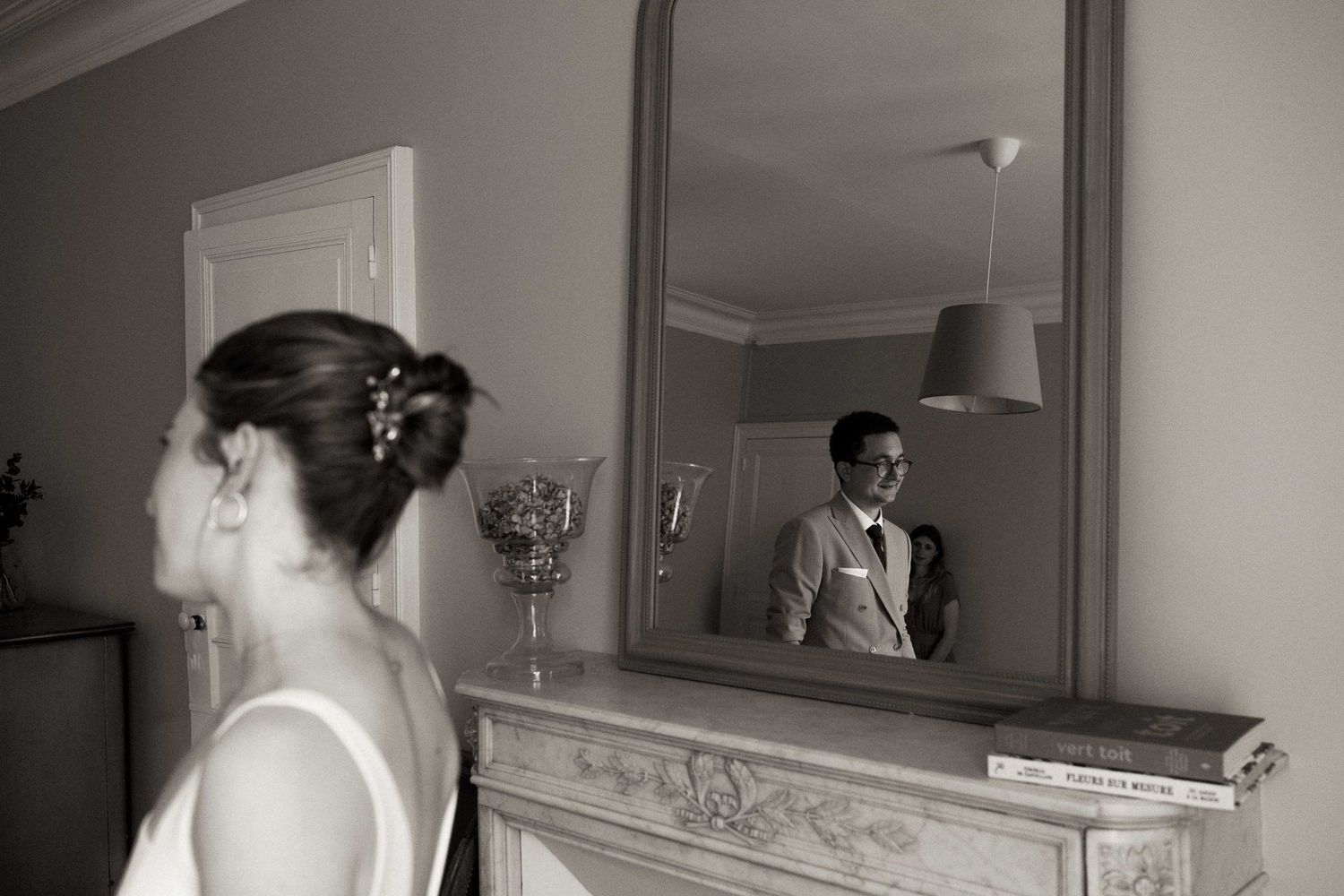 A series of vintage black and white photographs showing people getting ready in front of mirrors.