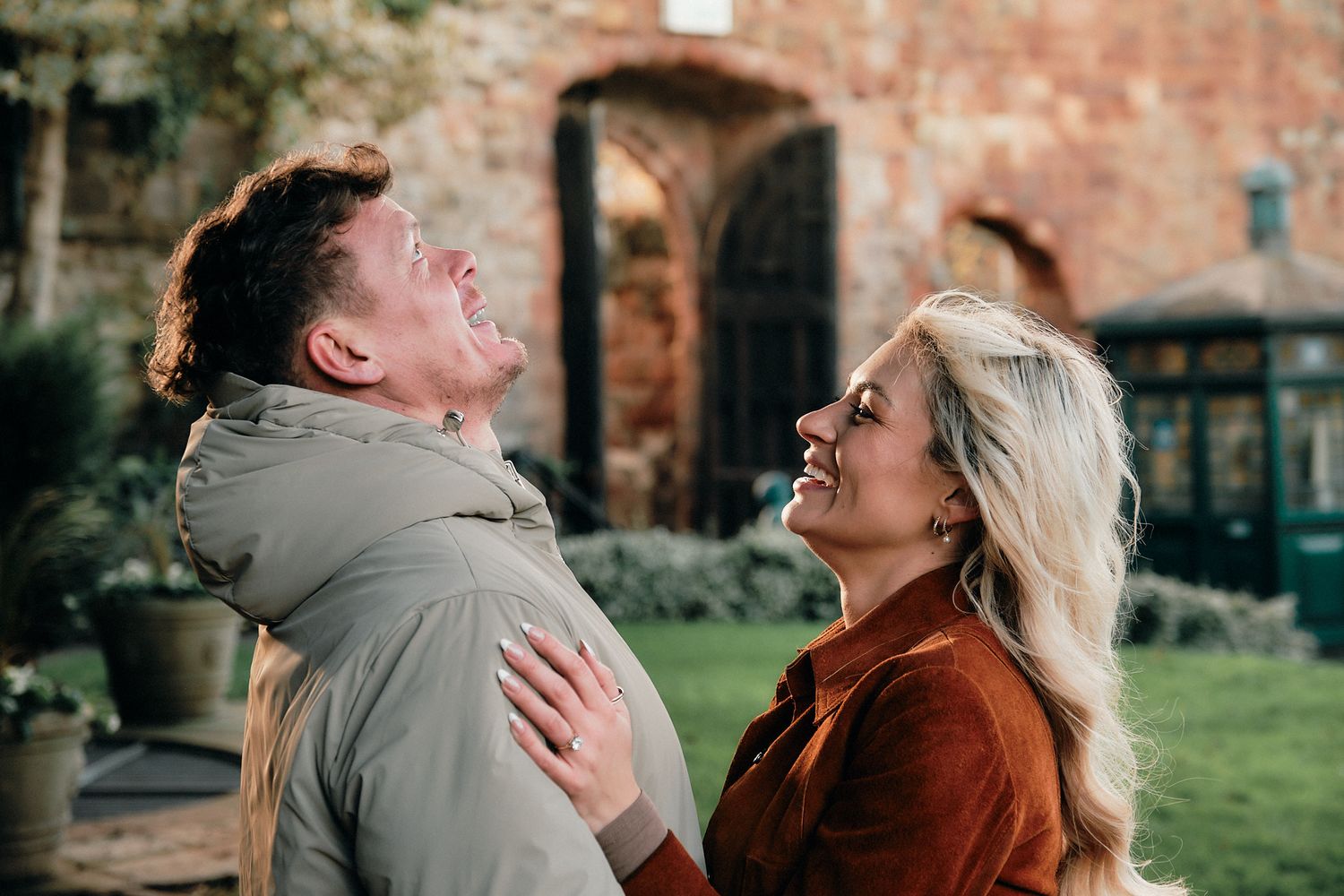 Romantic couple photography sequence showing intimate moments near historic architecture.