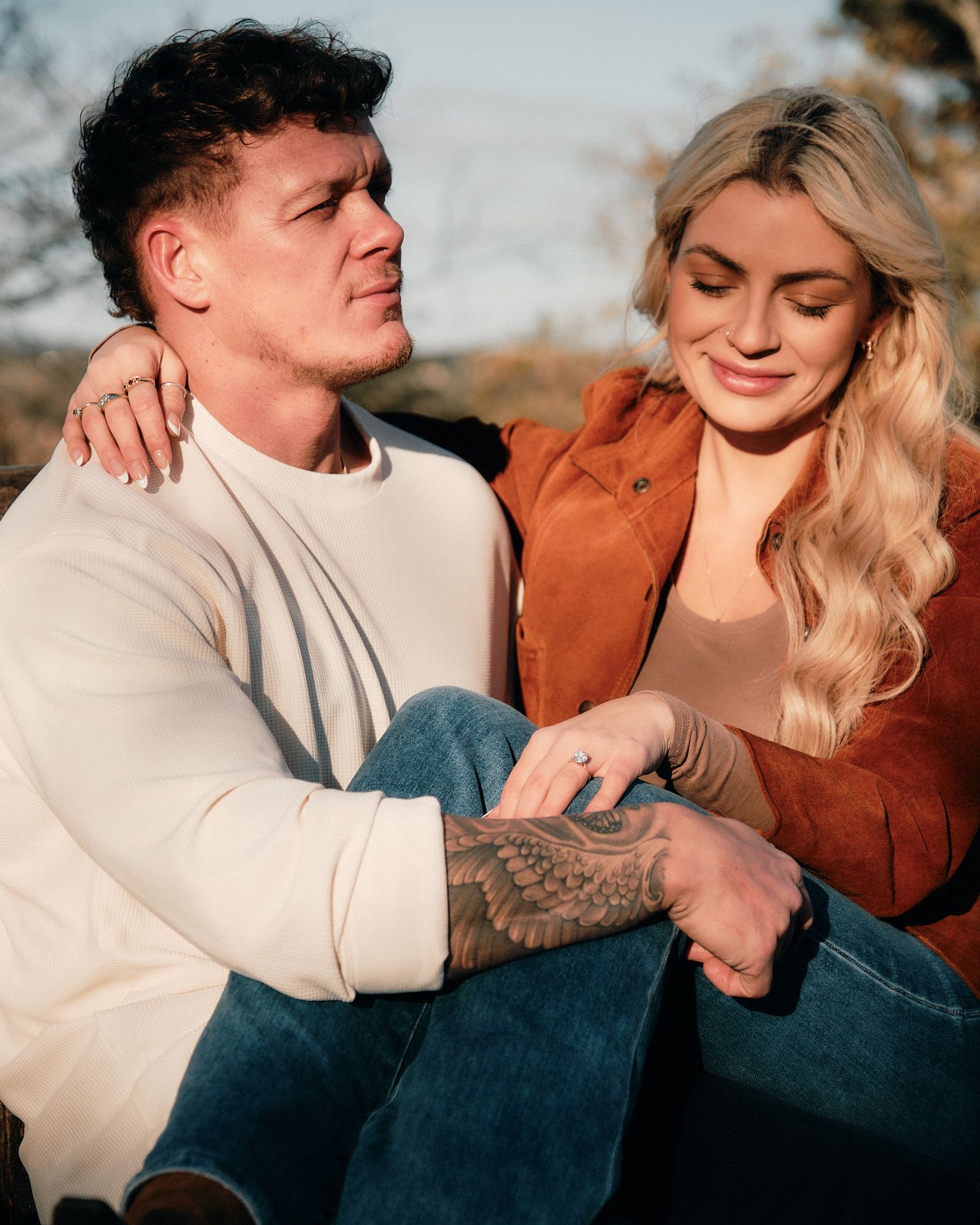 Intimate moments captured between a couple during a sunset photoshoot.