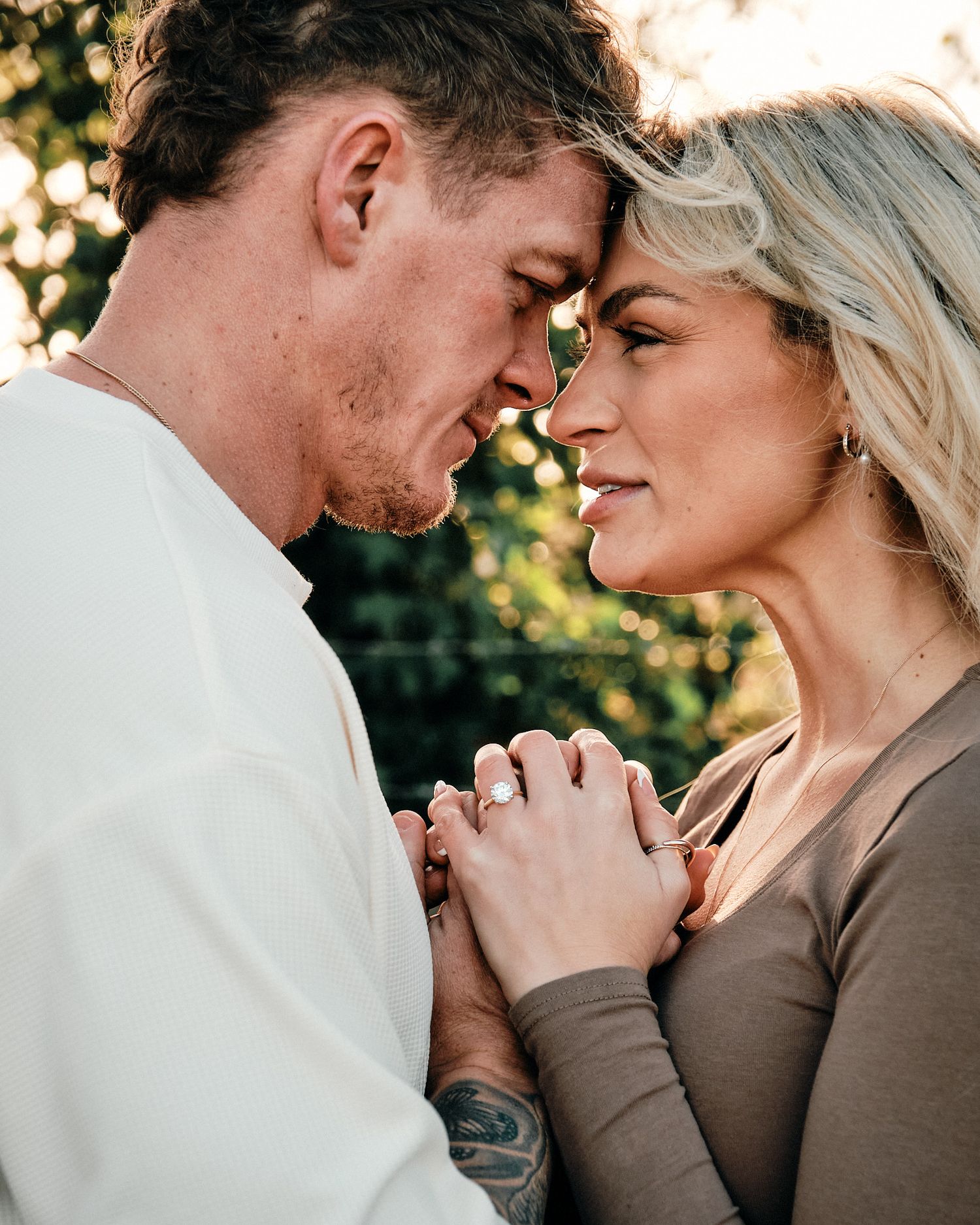 Intimate portrait series showing couple's emotional connection outdoors.