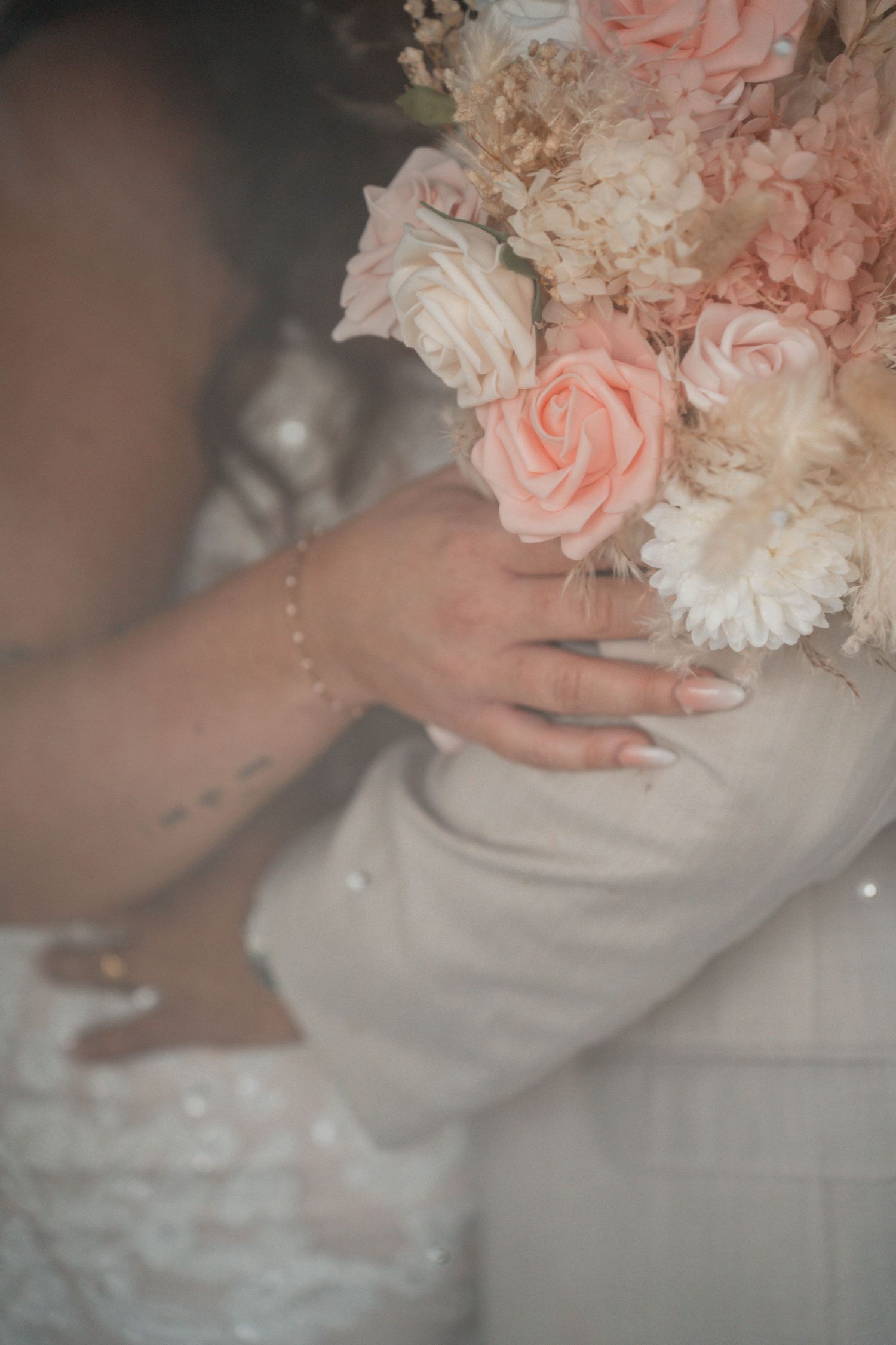 Delicate pink and white flowers arranged in soft focus.
