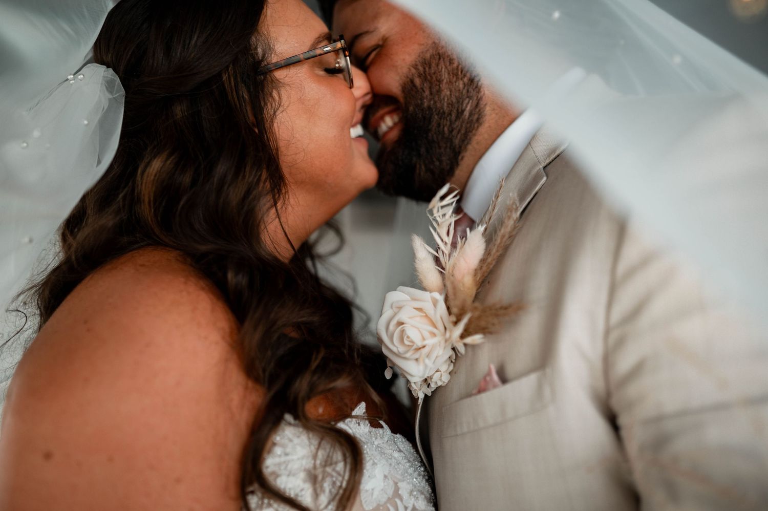 Romantic wedding couple sharing intimate moments in a series of close-up shots with soft lighting.