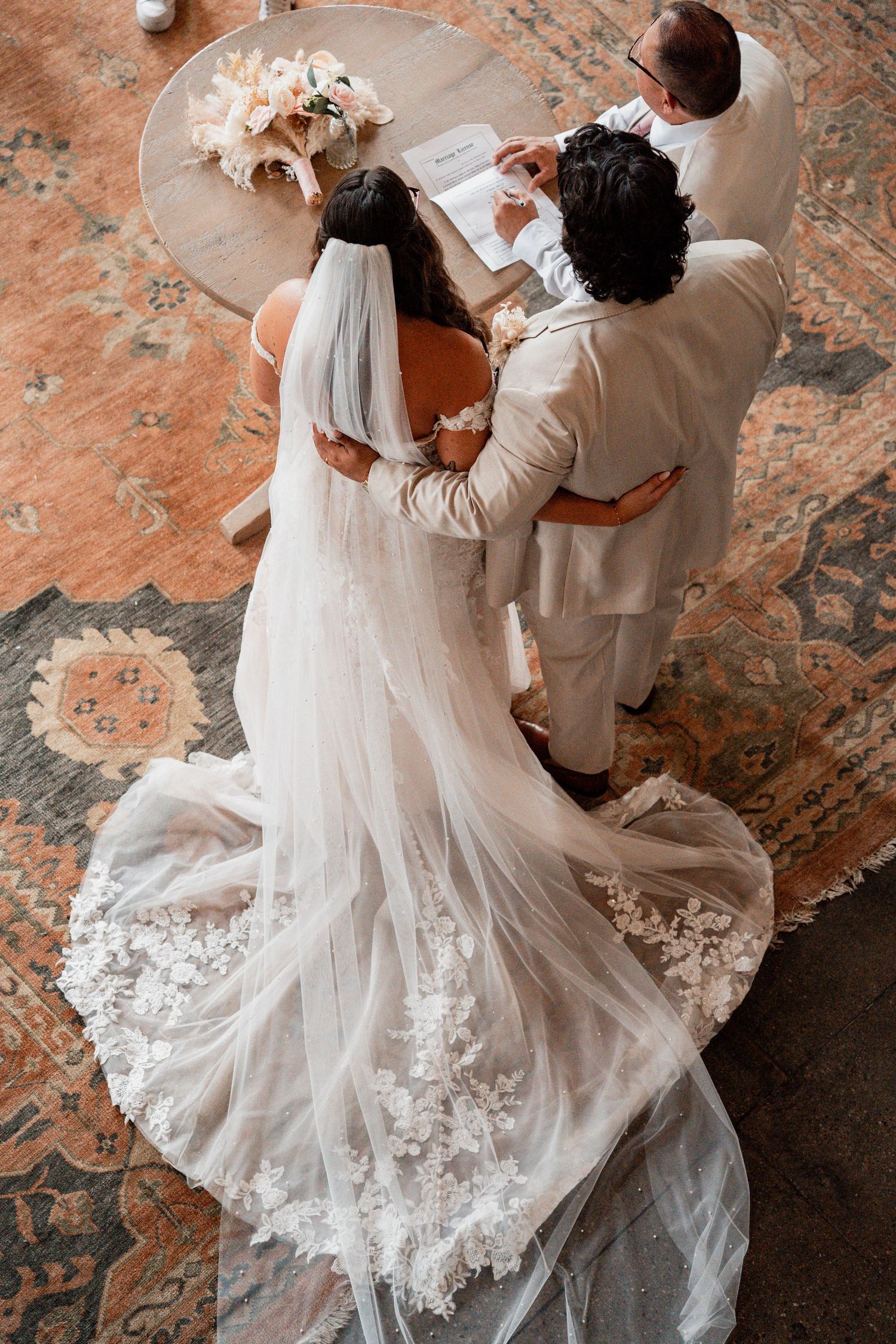 Romantic dance sequence showing flowing white wedding dress against textured floor.