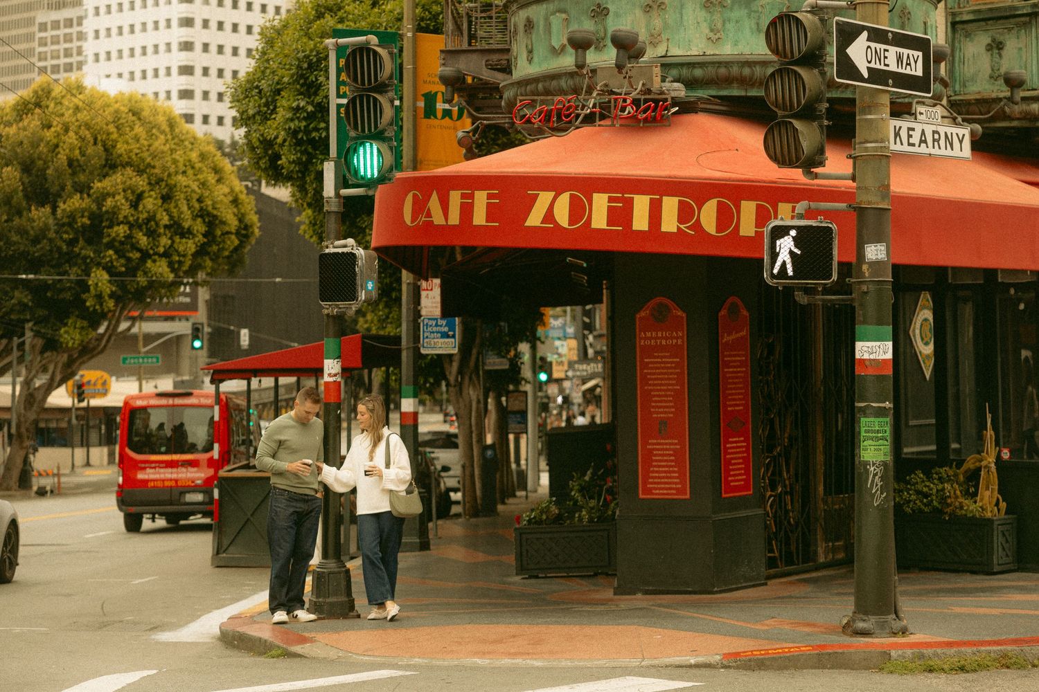 Cafe Zoetrope restaurant corner entrance with red awning at Kearny Street intersection in San Francisco.