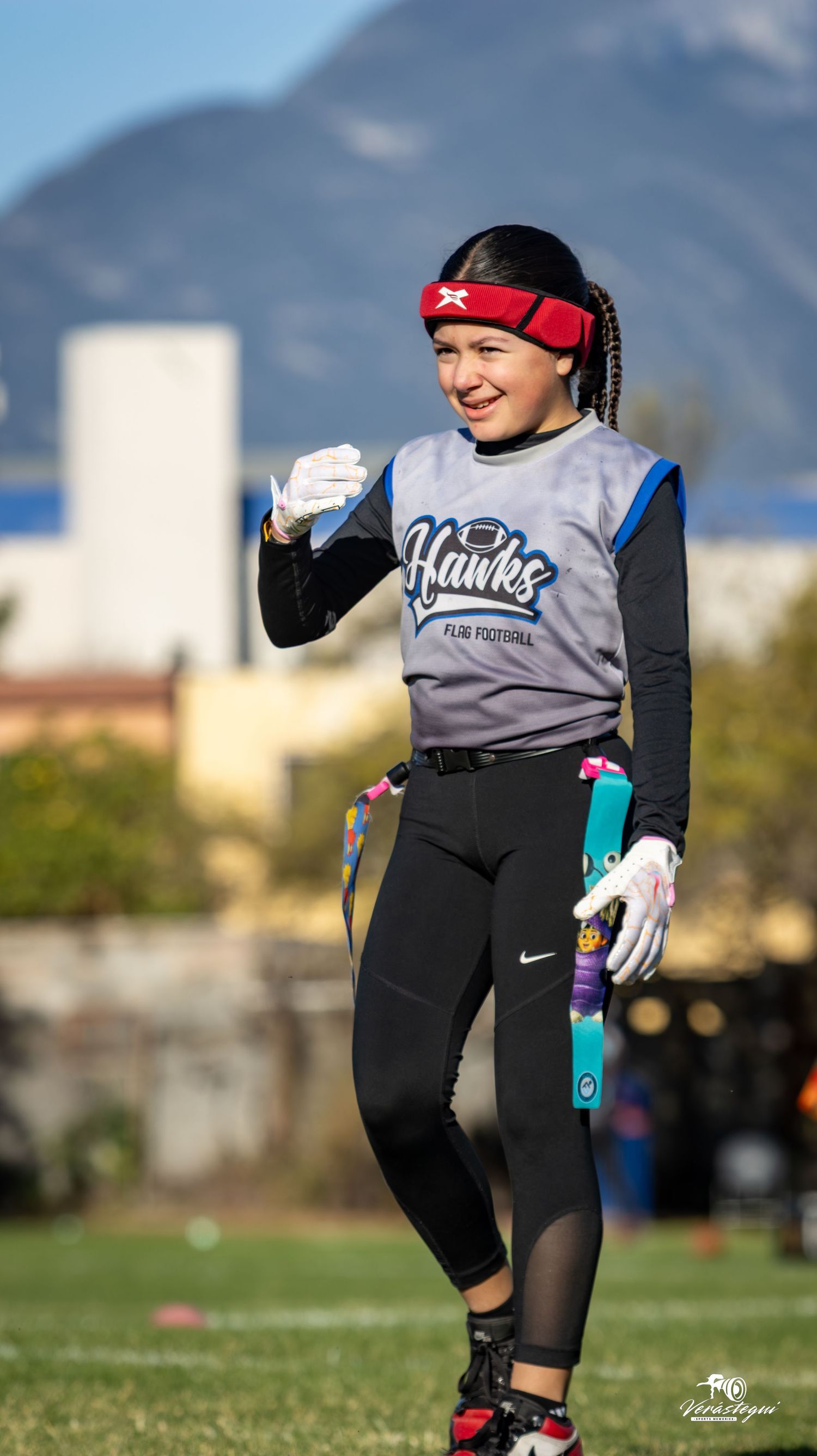 A series of action shots showing a softball player in black athletic gear practicing fielding drills on a grass field.