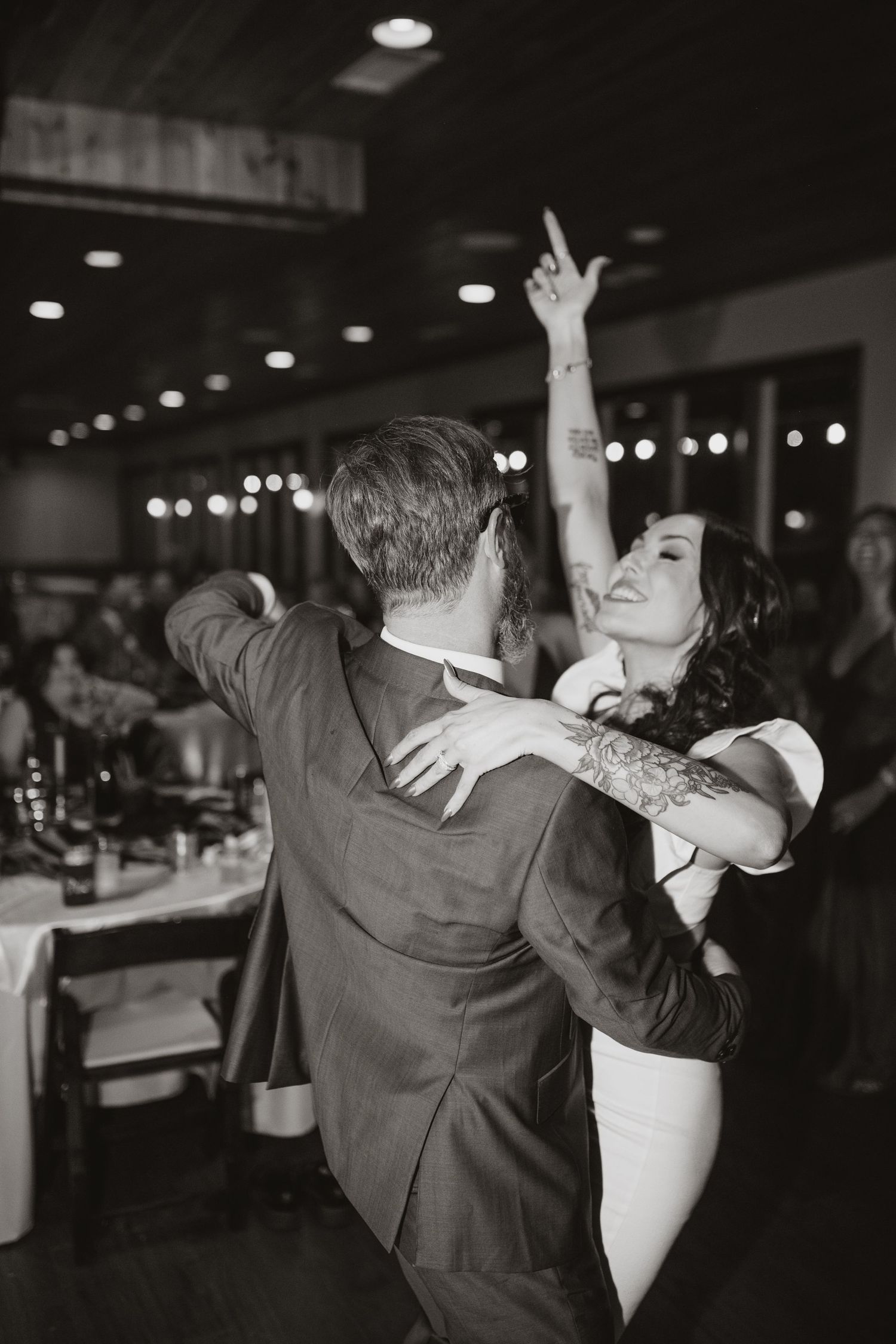 a couple living it up and dancing on the dance floor on their Alabama wedding day