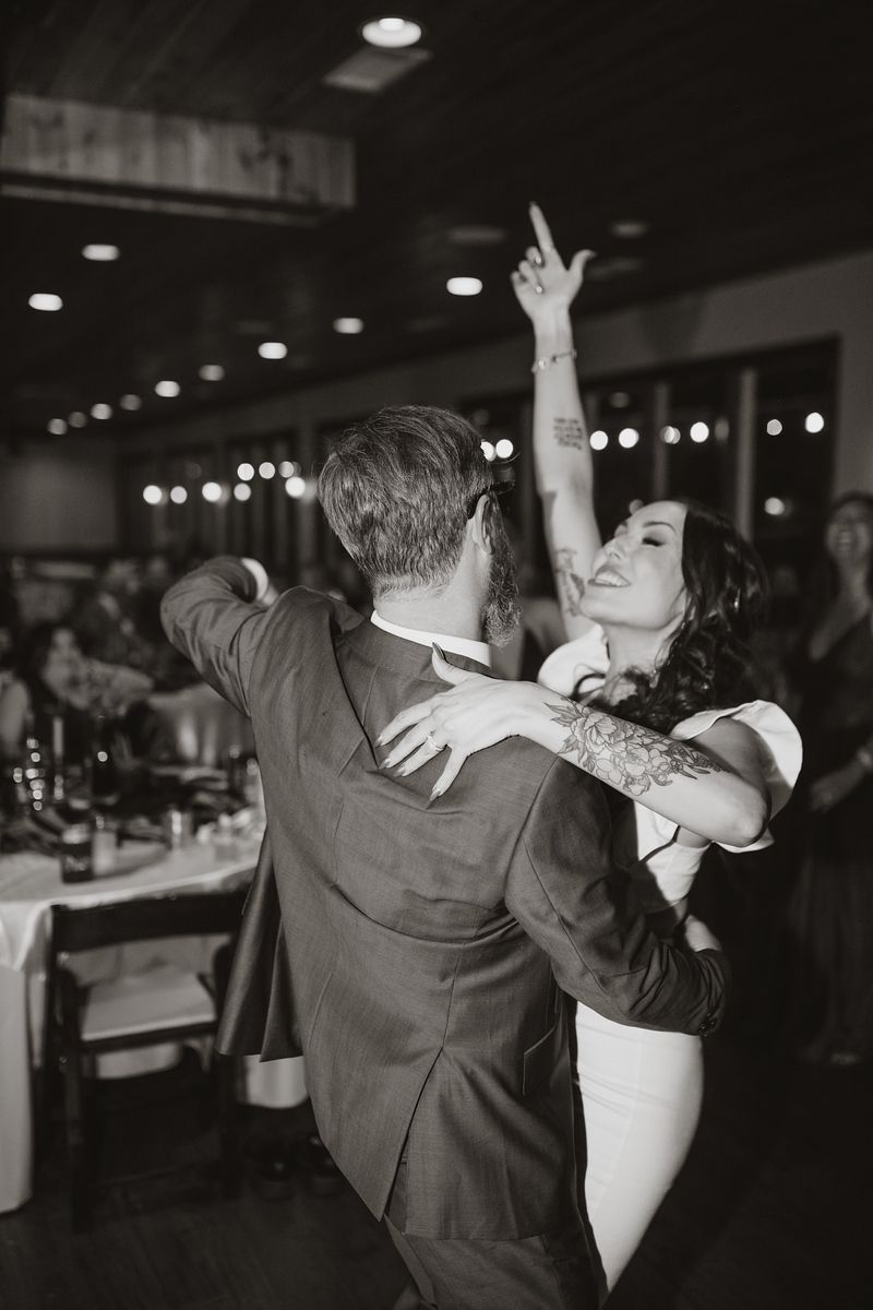 a couple living it up and dancing on the dance floor on their Alabama wedding day