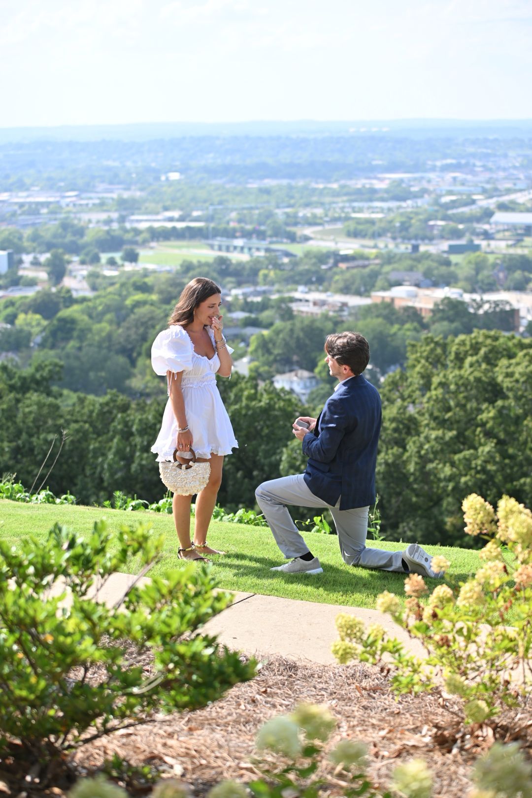a couple getting engaged at The Club in Birmingham overlooking the city