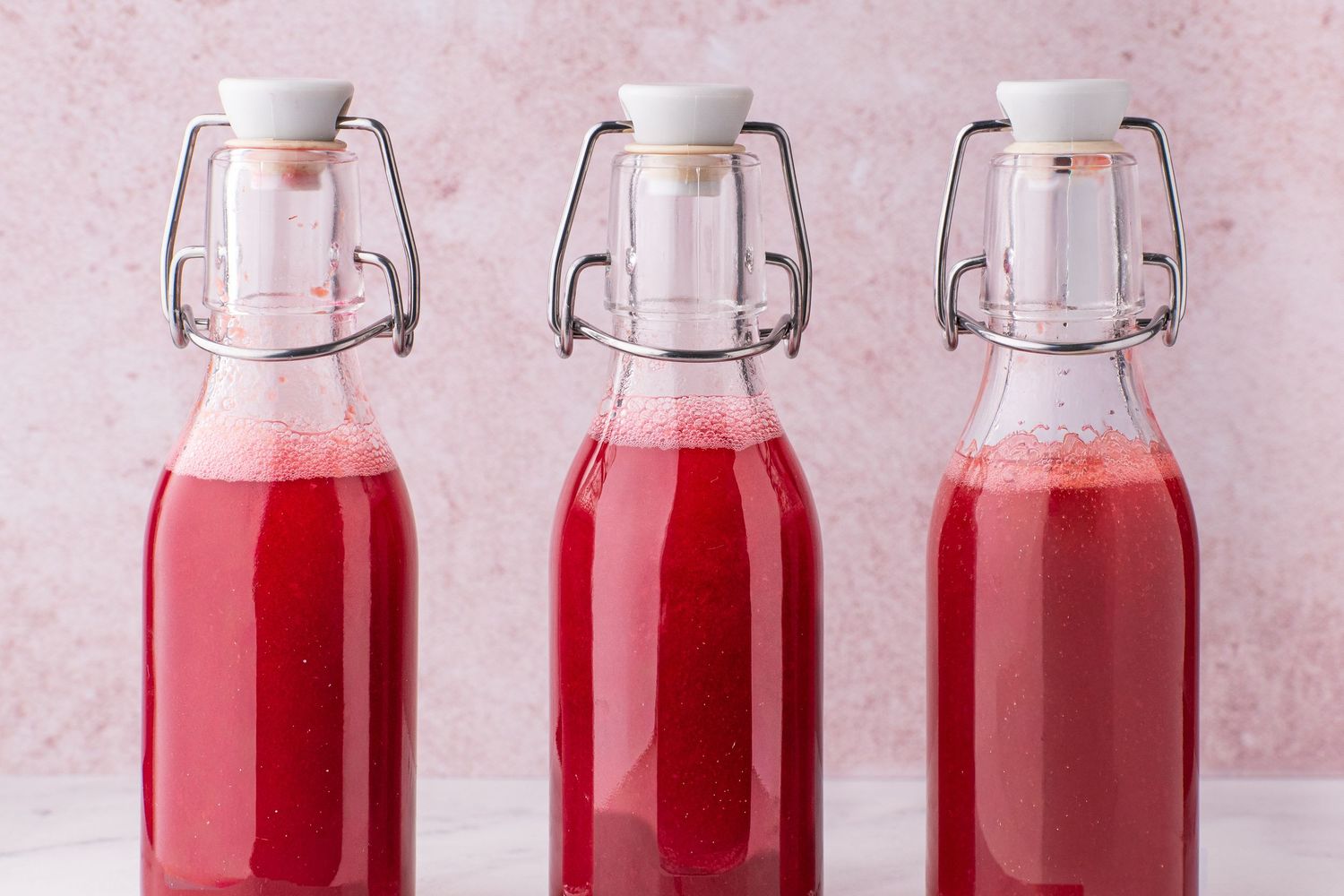 three bottles of homemade syrup
