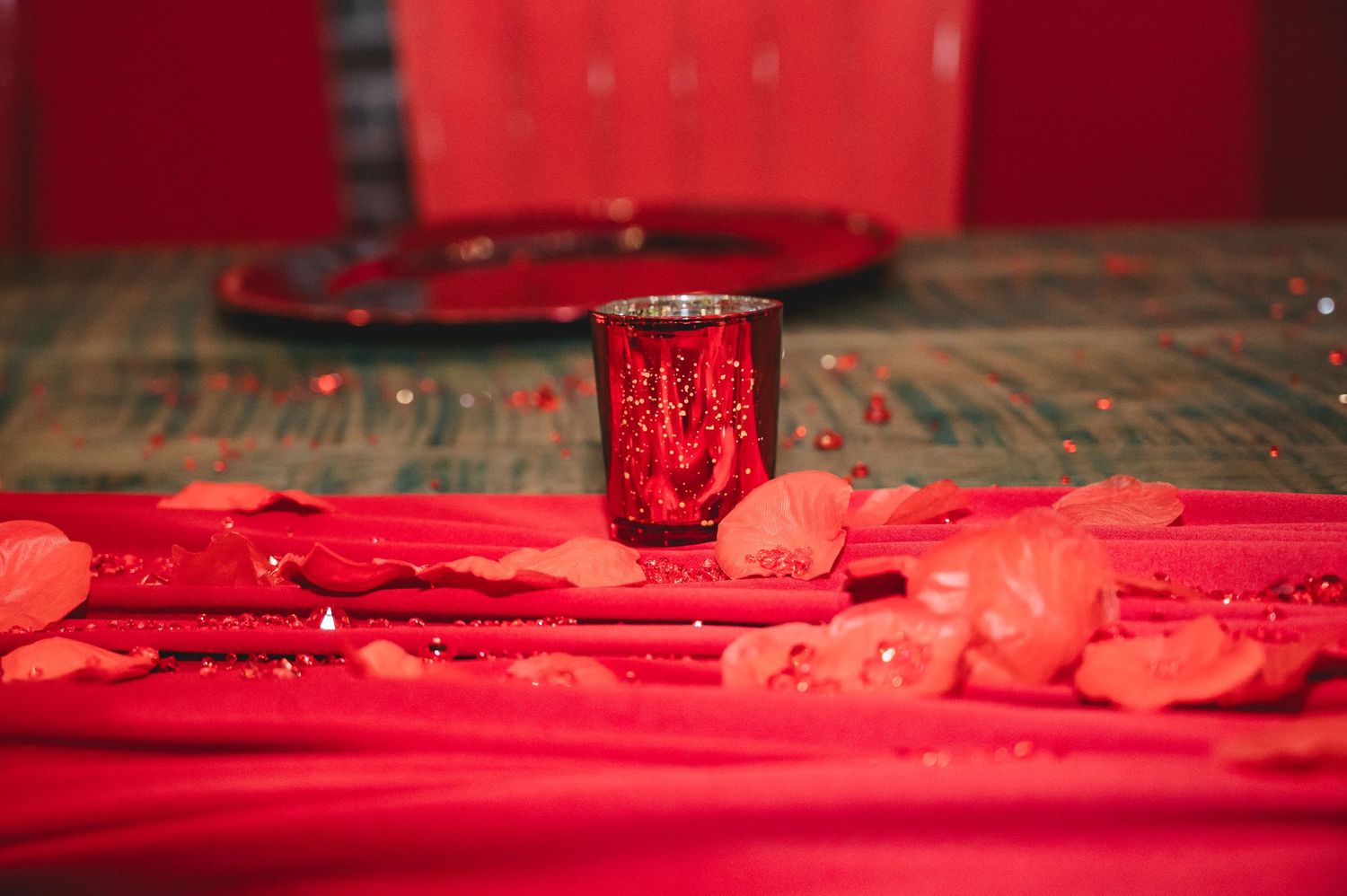 Neon red lights illuminate a wooden surface with decorative details.