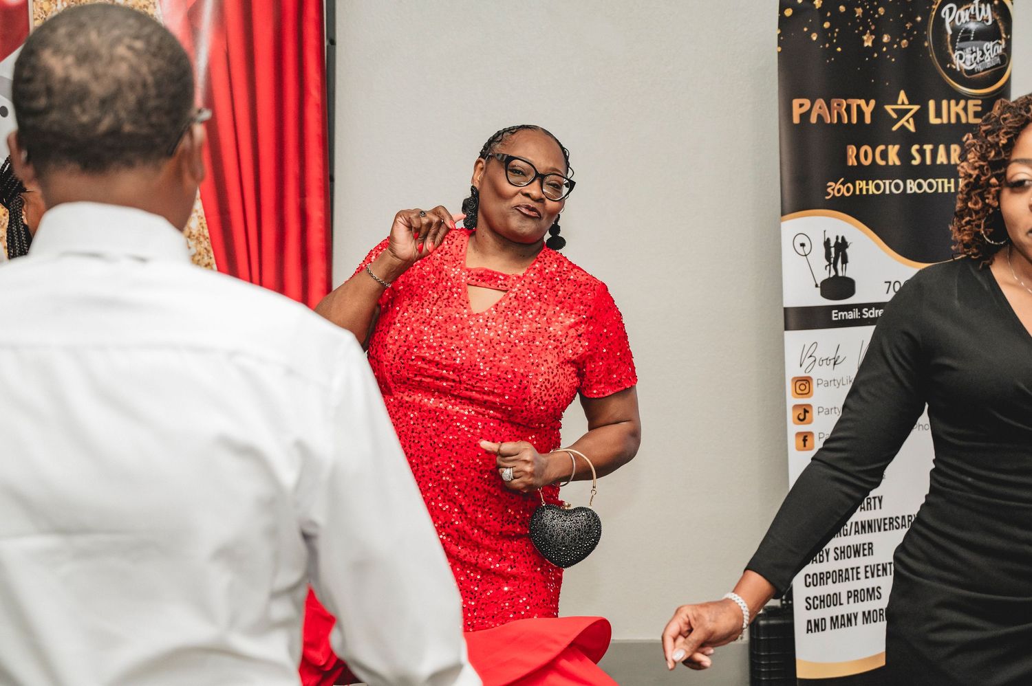 Party guests dancing and having fun at a casino-themed celebration.