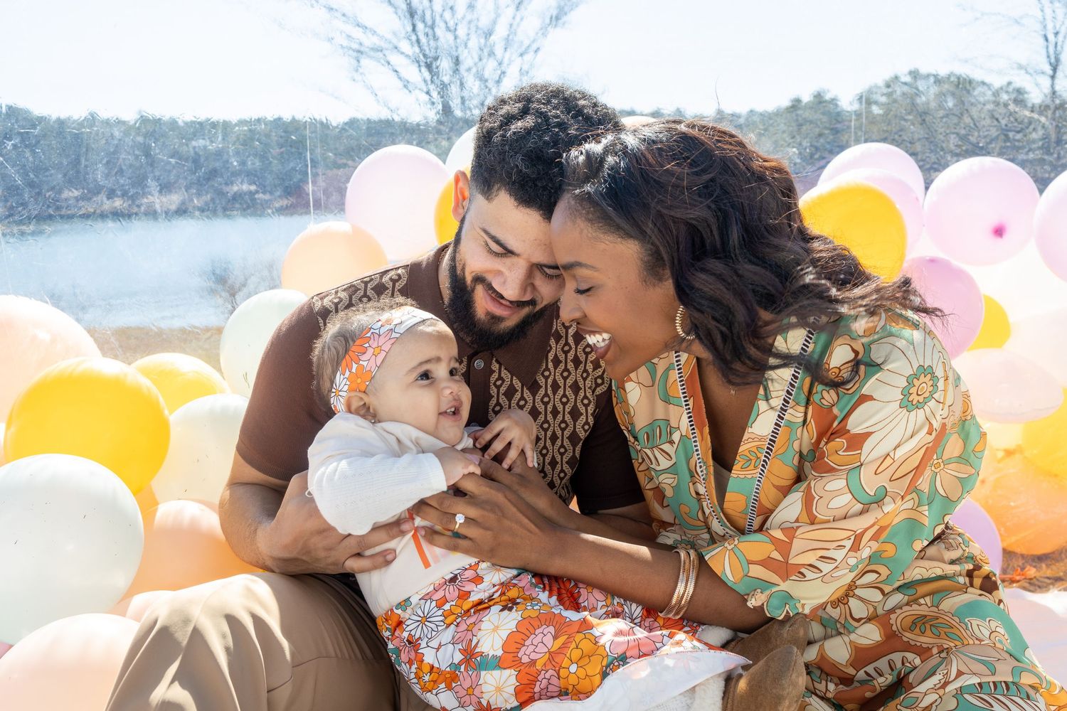 Multiple photos show intimate family moments with a baby and parents against a backdrop of balloons and natural light.