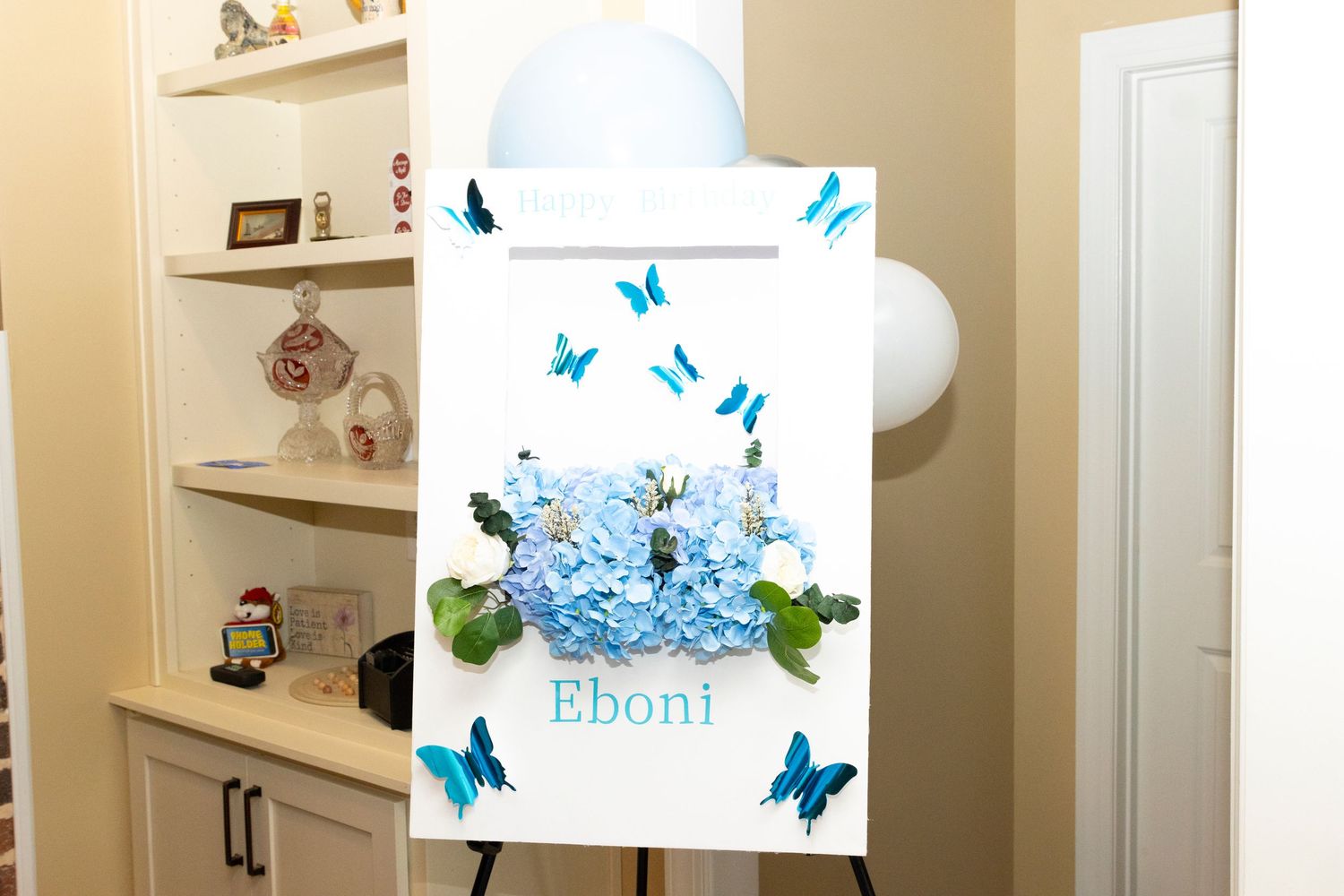 A series of blue butterfly wall decals mounted on white walls create an elegant decorative accent in a room.