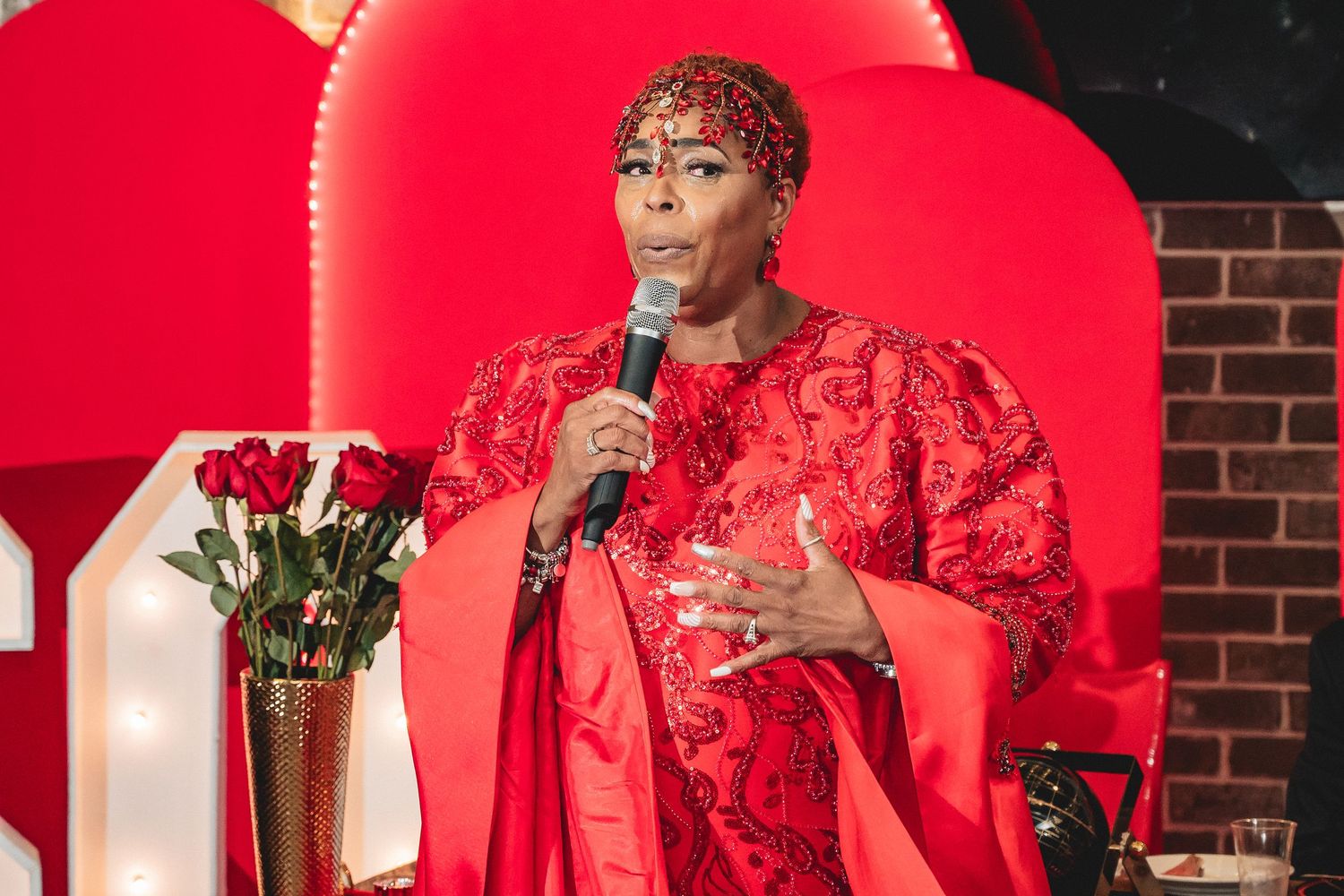 Special event venue showcases dramatic red lighting and formal celebration atmosphere.