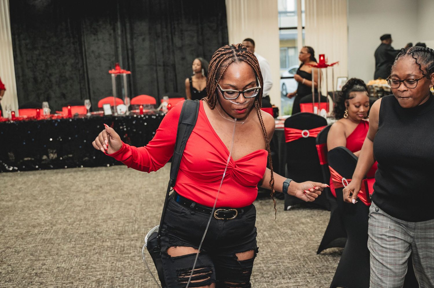 Party guests dancing and having fun at a casino-themed celebration.