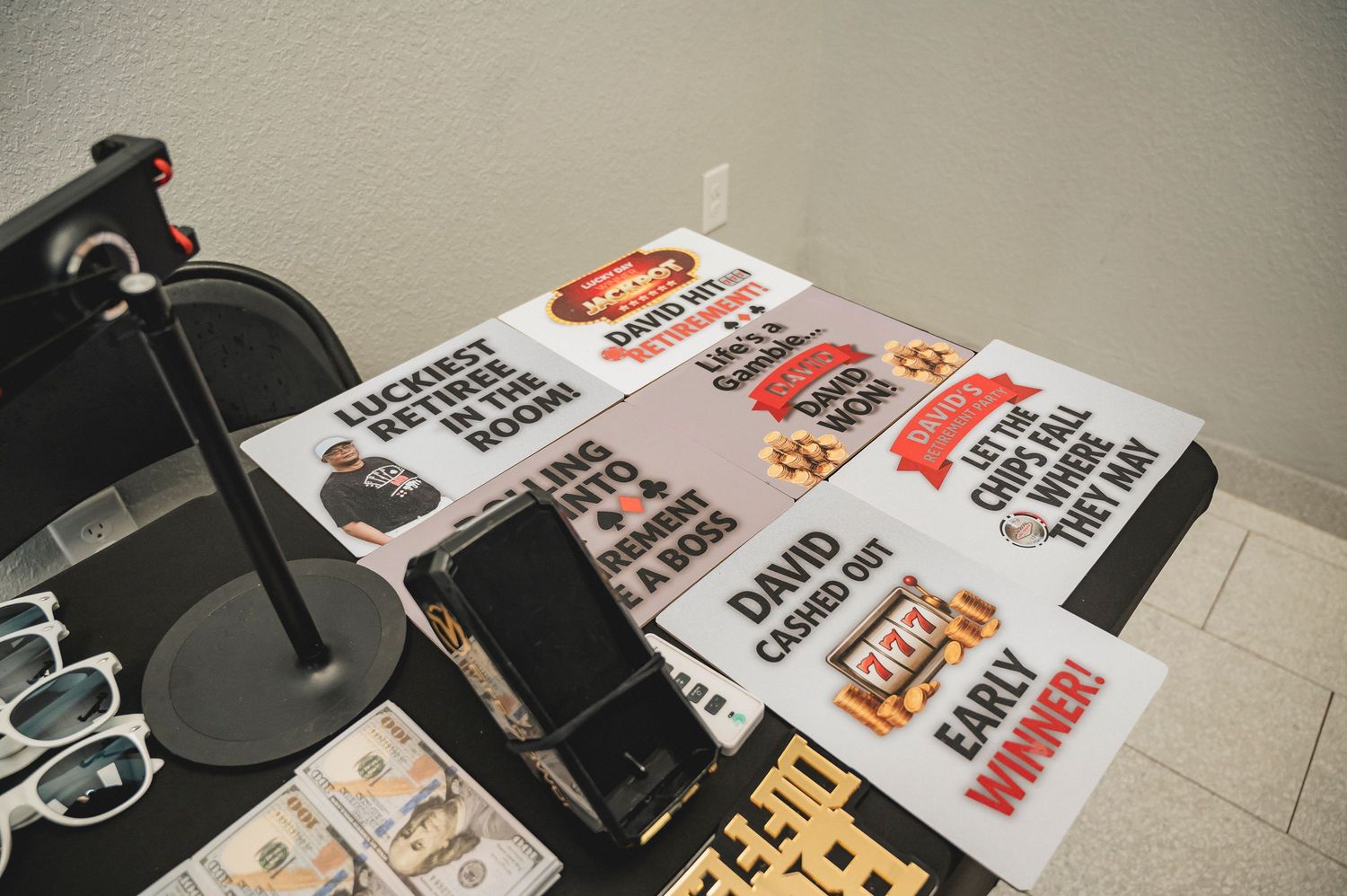 Close-up of party decorations and printed materials in red and black colors.