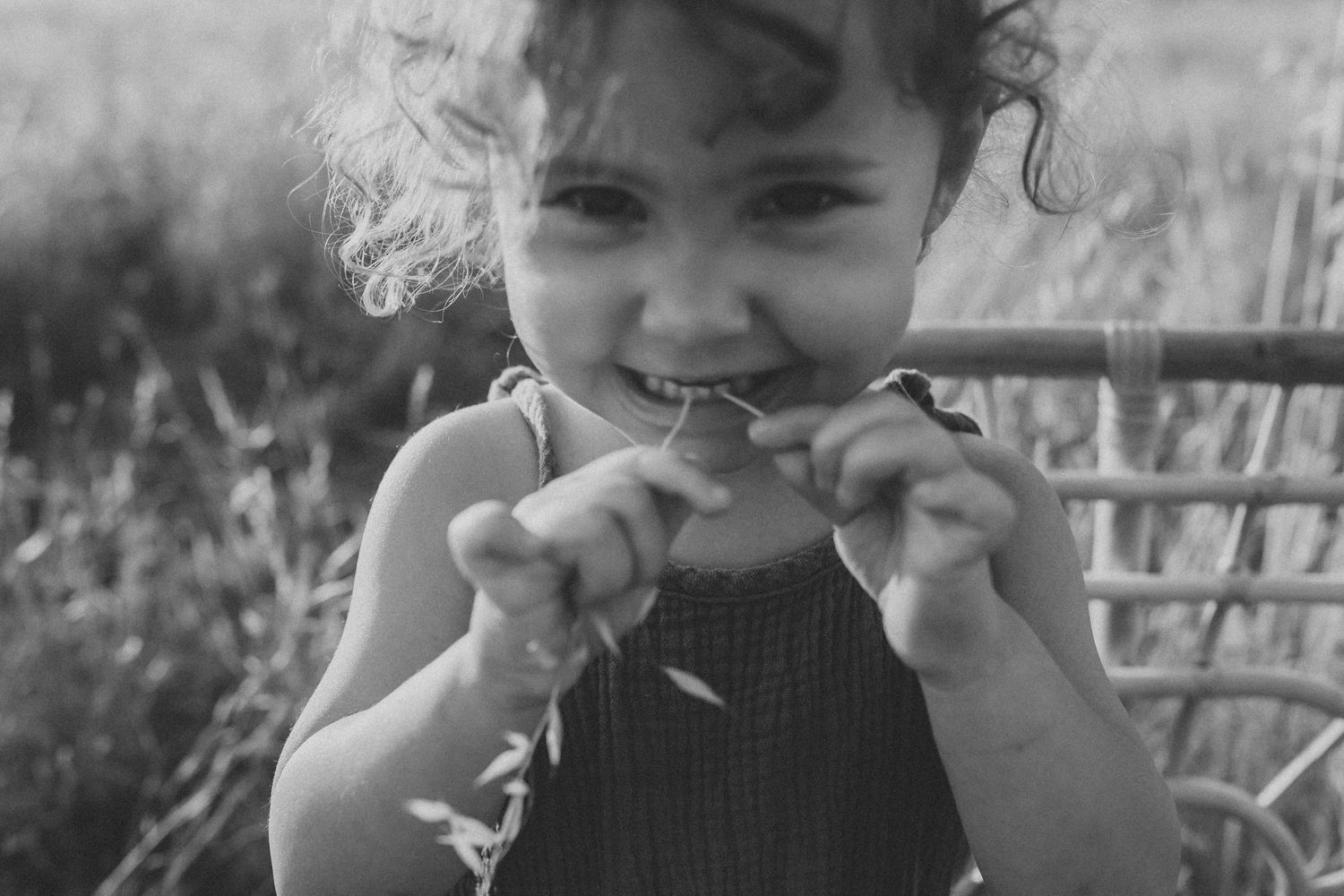 Series of black and white close-up expressions showing playful emotions.