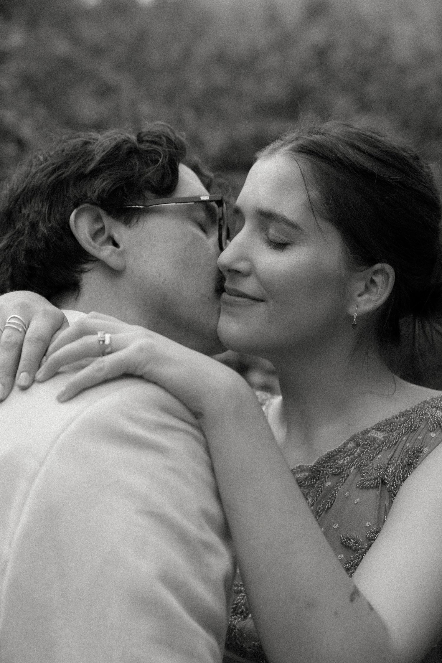 A tender black and white romantic moment between a couple sharing a loving embrace.