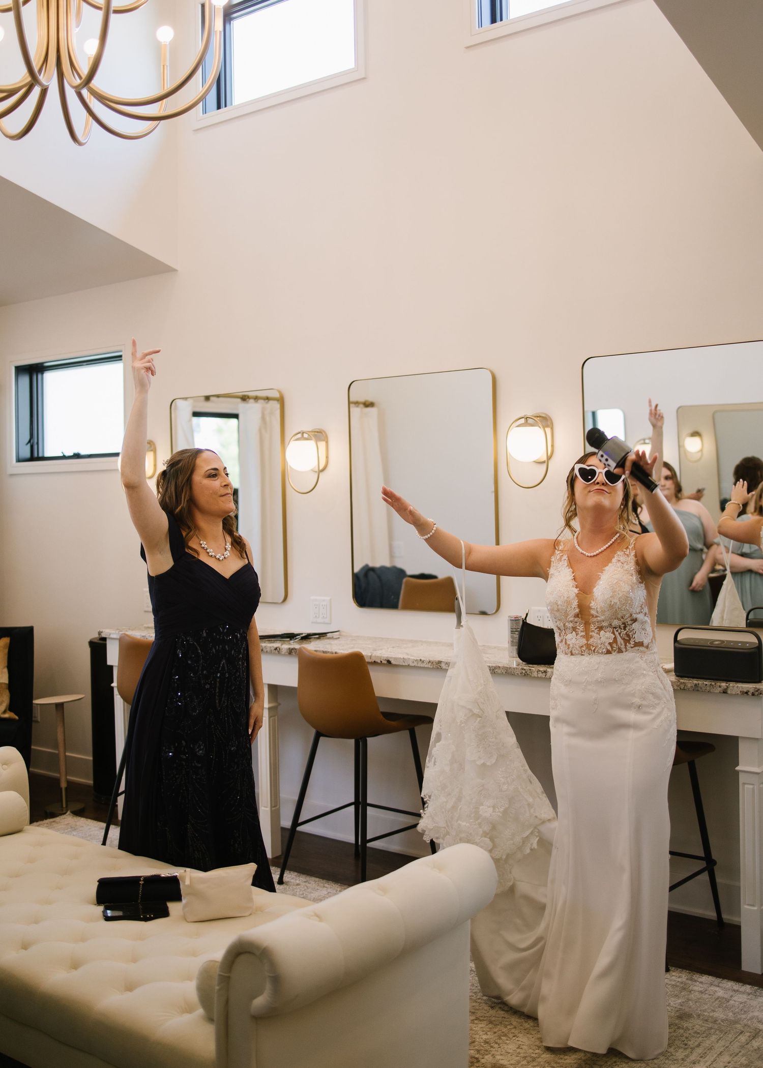 A sequence of images showing people celebrating and posing in a bridal suite with joyful expressions and wedding attire.