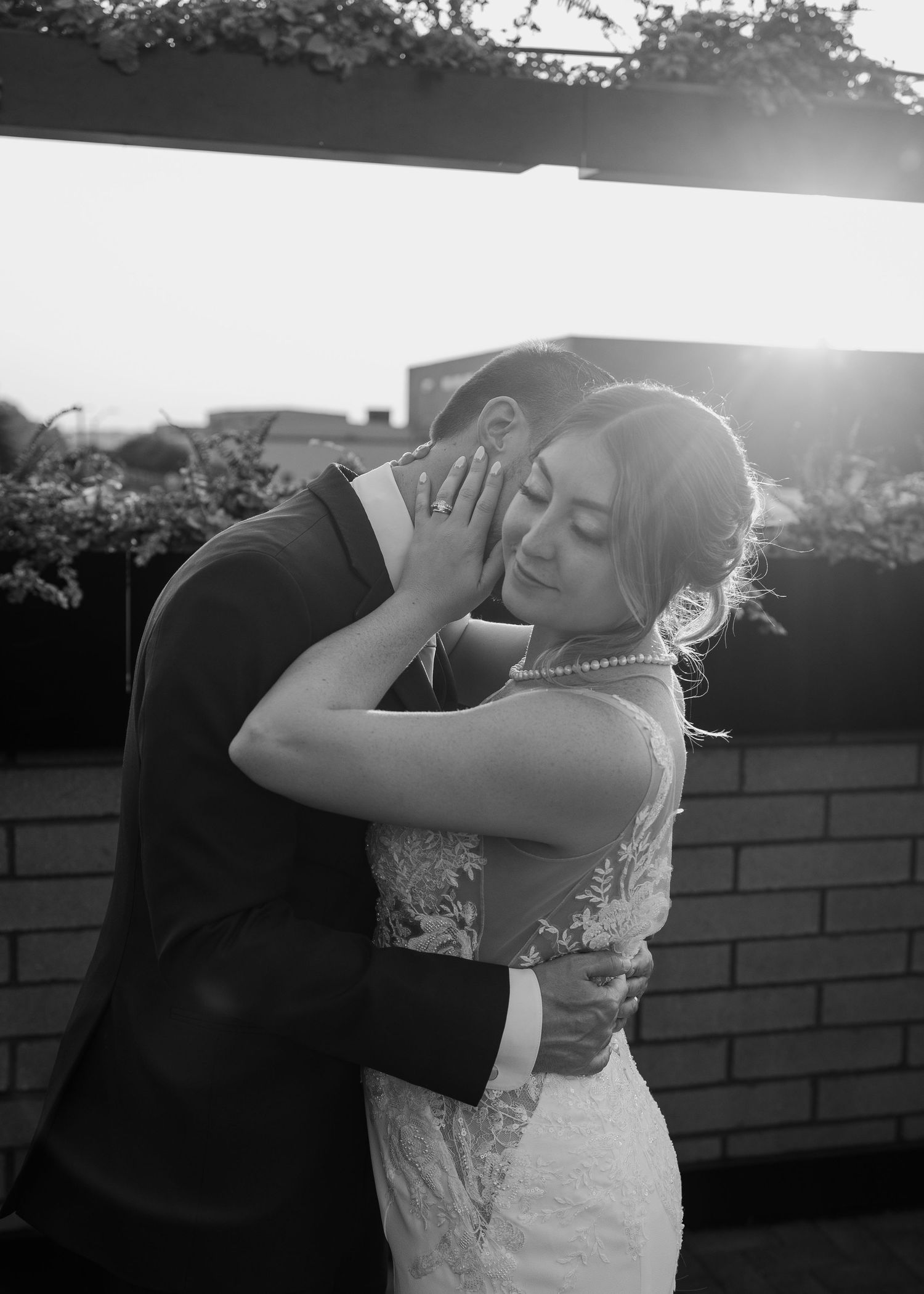 A panoramic black and white photo sequence shows a couple dancing together during their first wedding dance.