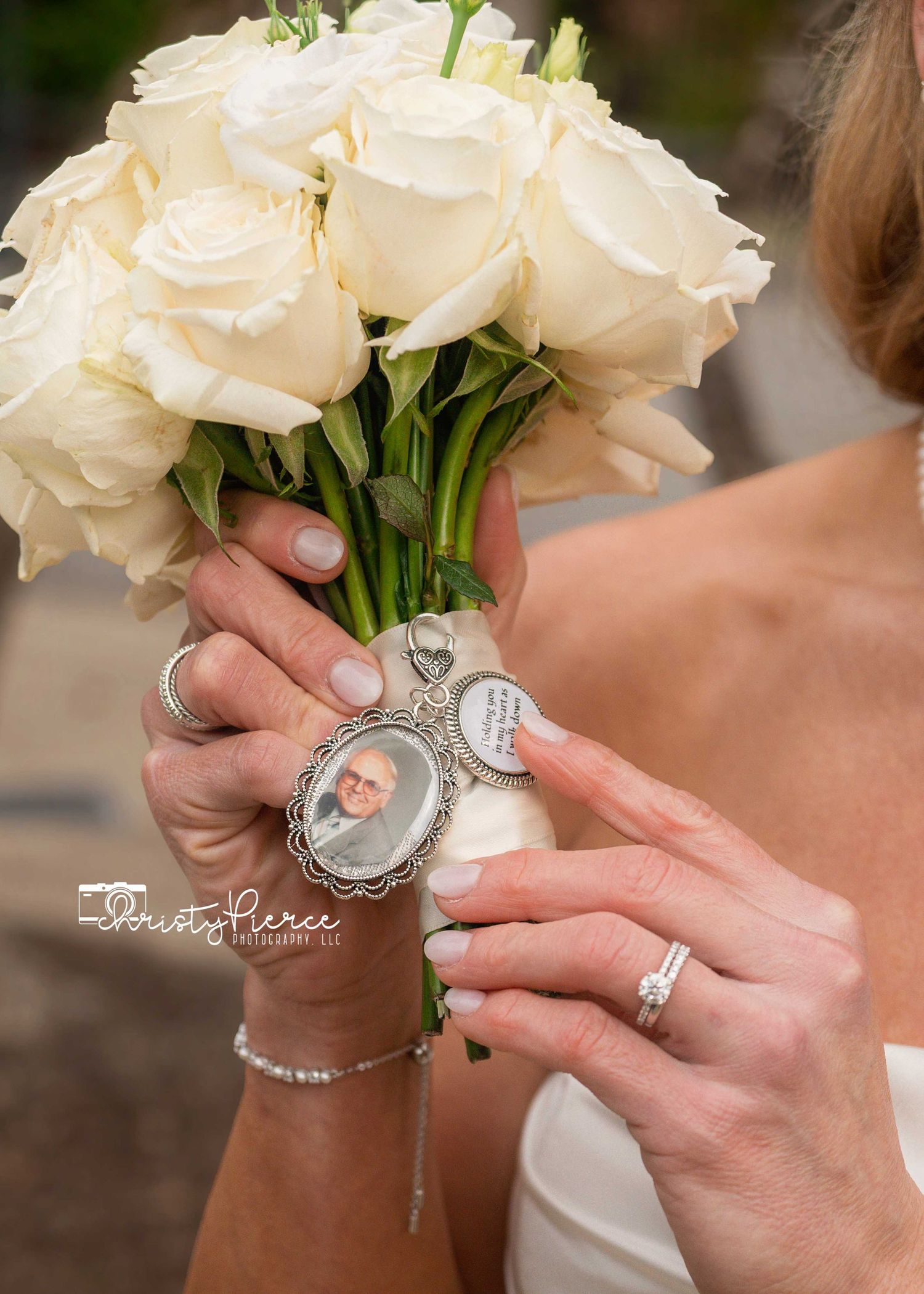 Close-up shots of a sparkling diamond engagement ring with white roses in the background.