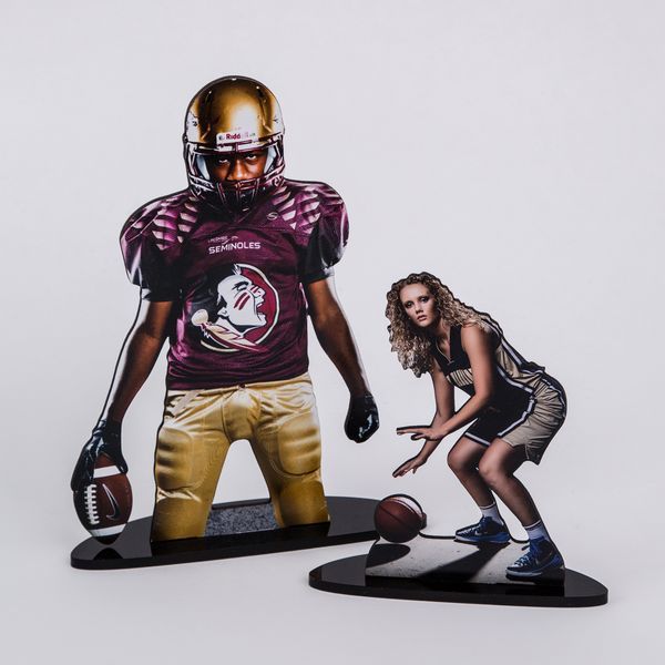 Football players in protective gear demonstrate dynamic poses and stances during a photo session against a white backdrop.
