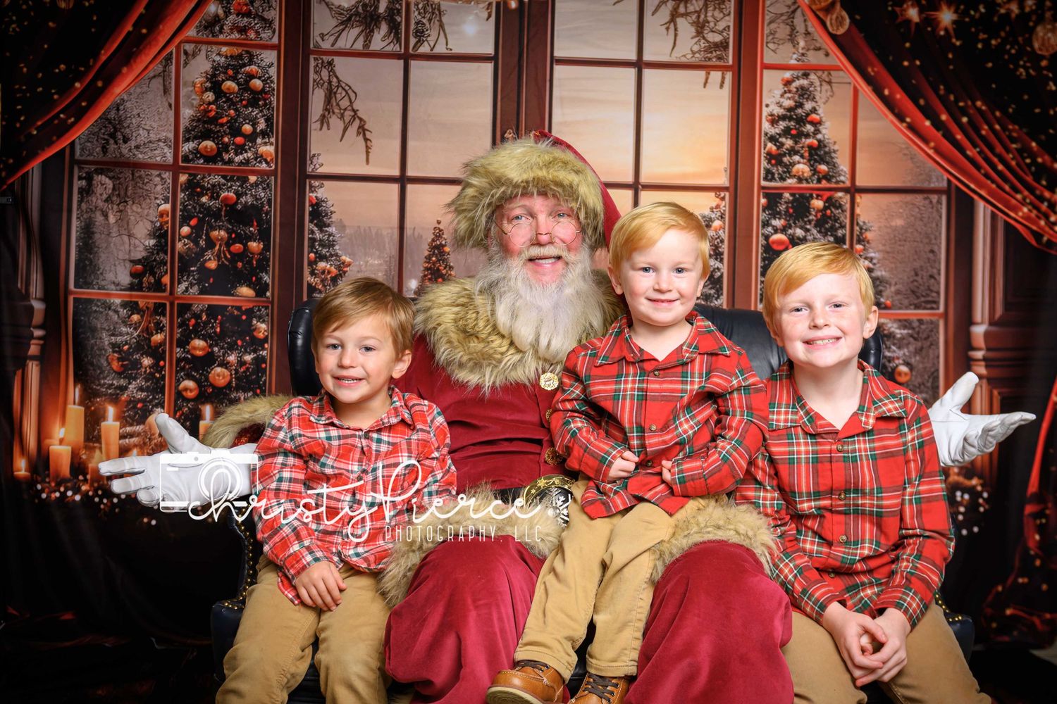 Three children in matching red plaid outfits pose with traditional holiday figure in front of decorated Christmas window.
