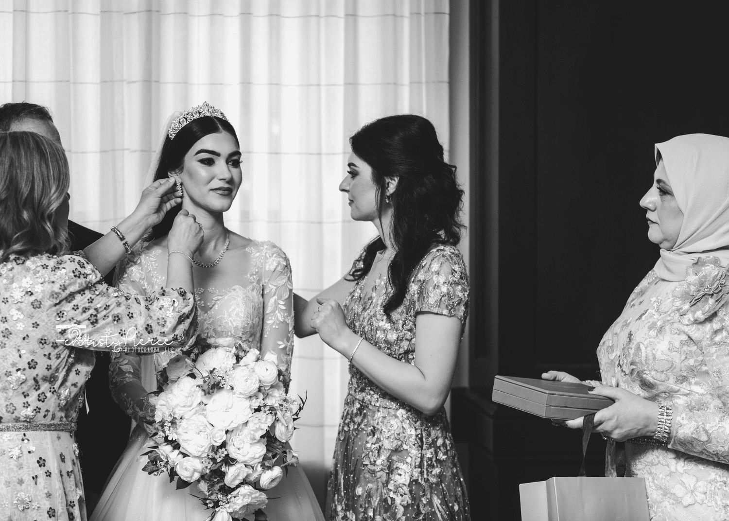 A collection of black and white wedding photos showing intimate moments during bridal preparations.