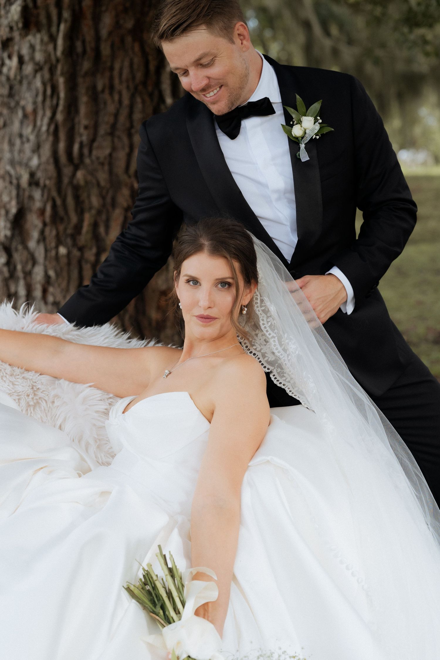 A romantic wedding photo series showing tender moments between a couple in formal attire against a rustic outdoor backdrop.