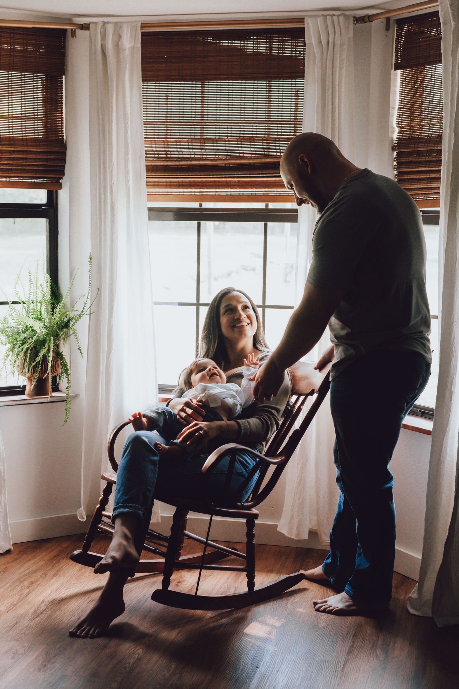 A series of photos showing intimate moments in a rocking chair by a window with natural light streaming in.