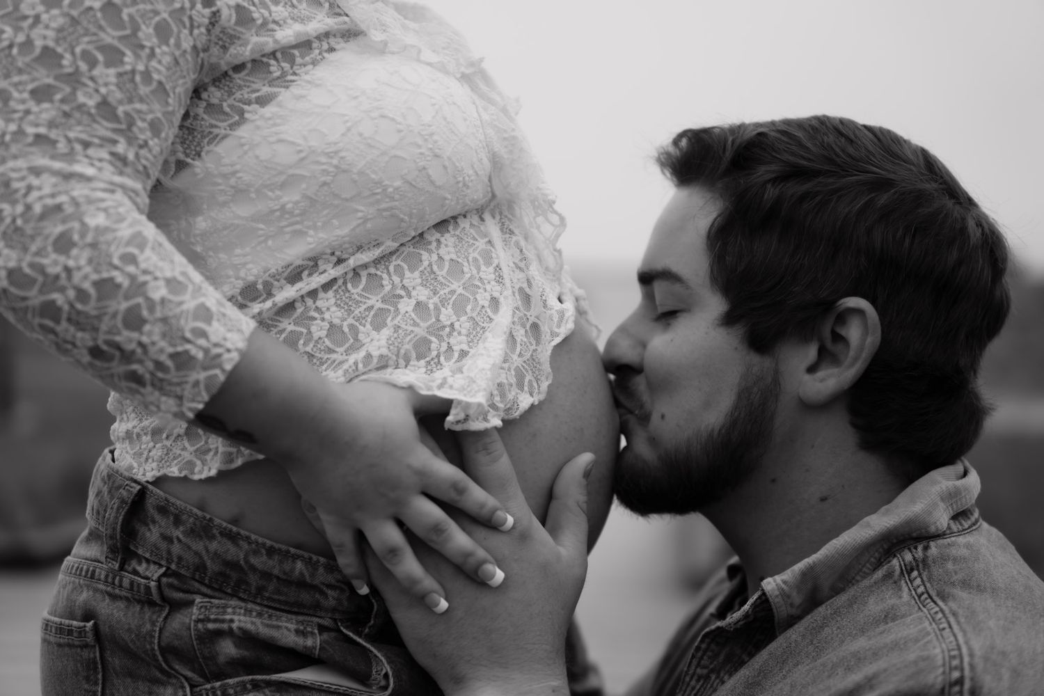 A romantic black and white photo sequence showing intimate moments between two people.
