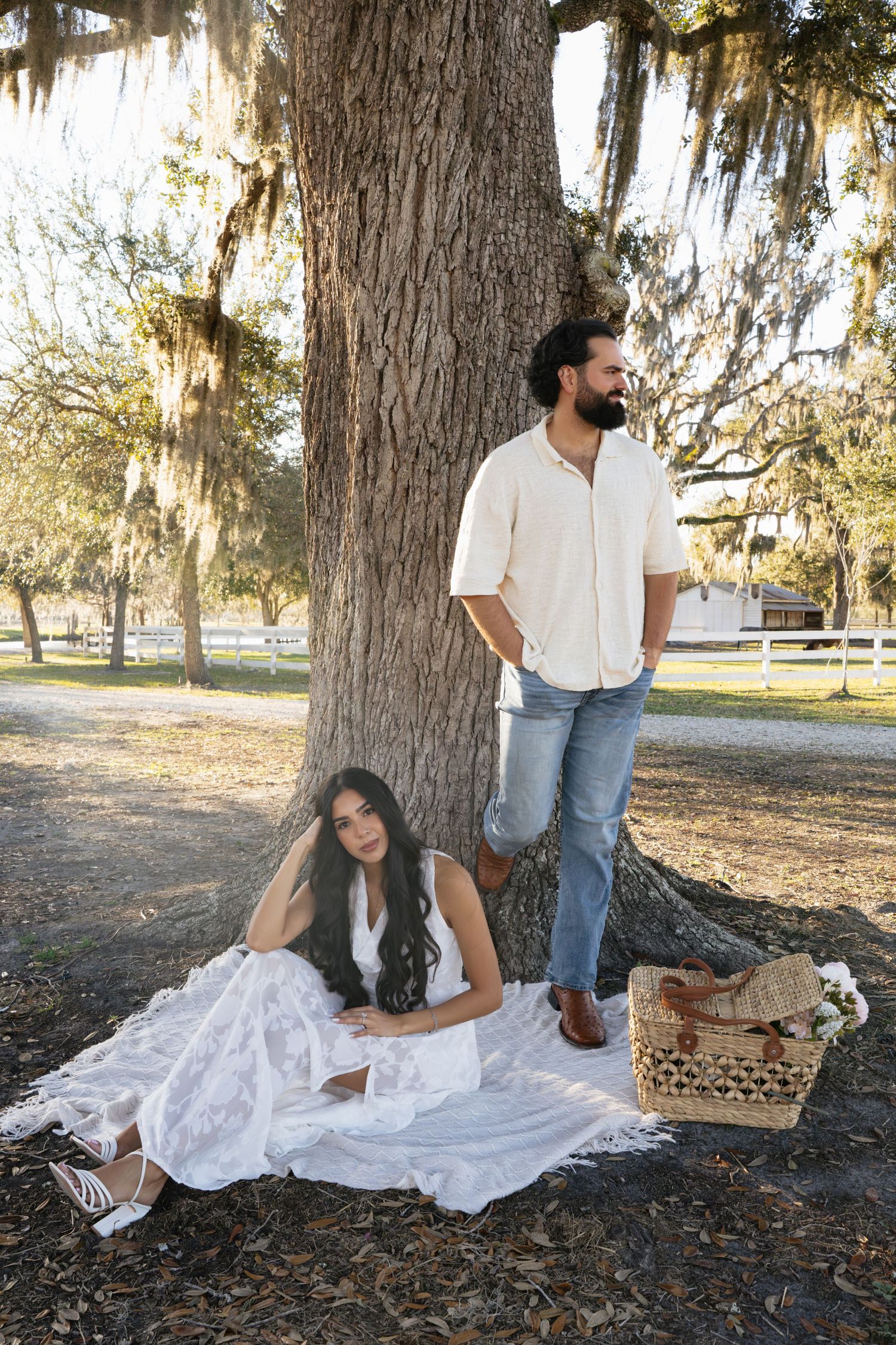 Couple sitting on a picnic blanket at Congaree and Penn in Jacksonville.