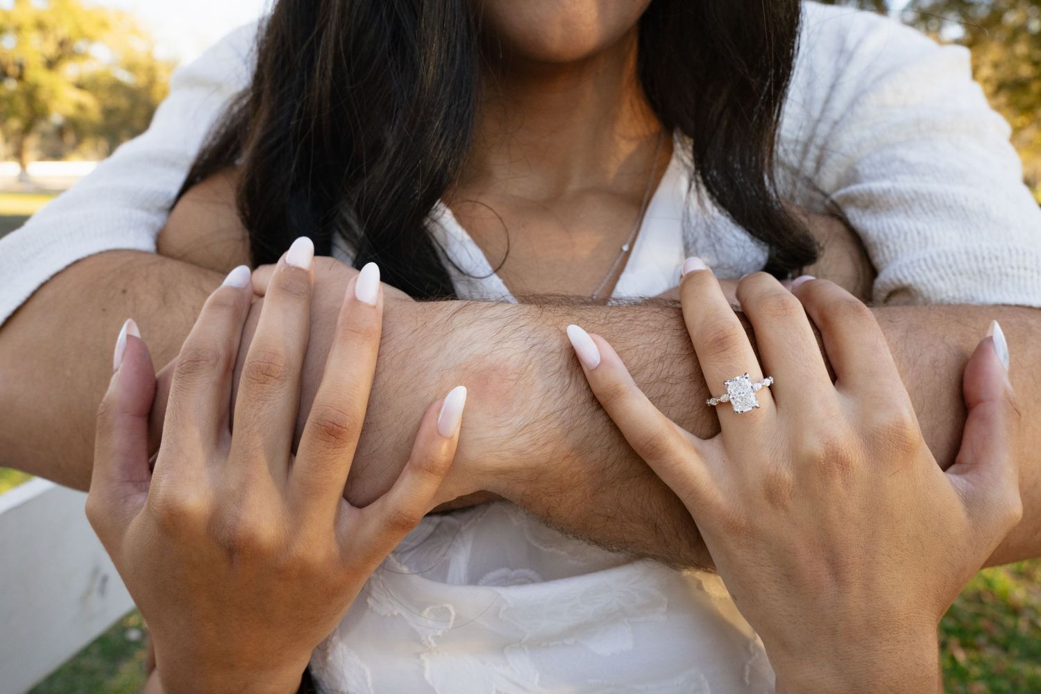 Close-up sequence showing hands counting fingers in American Sign Language against a blurred background.