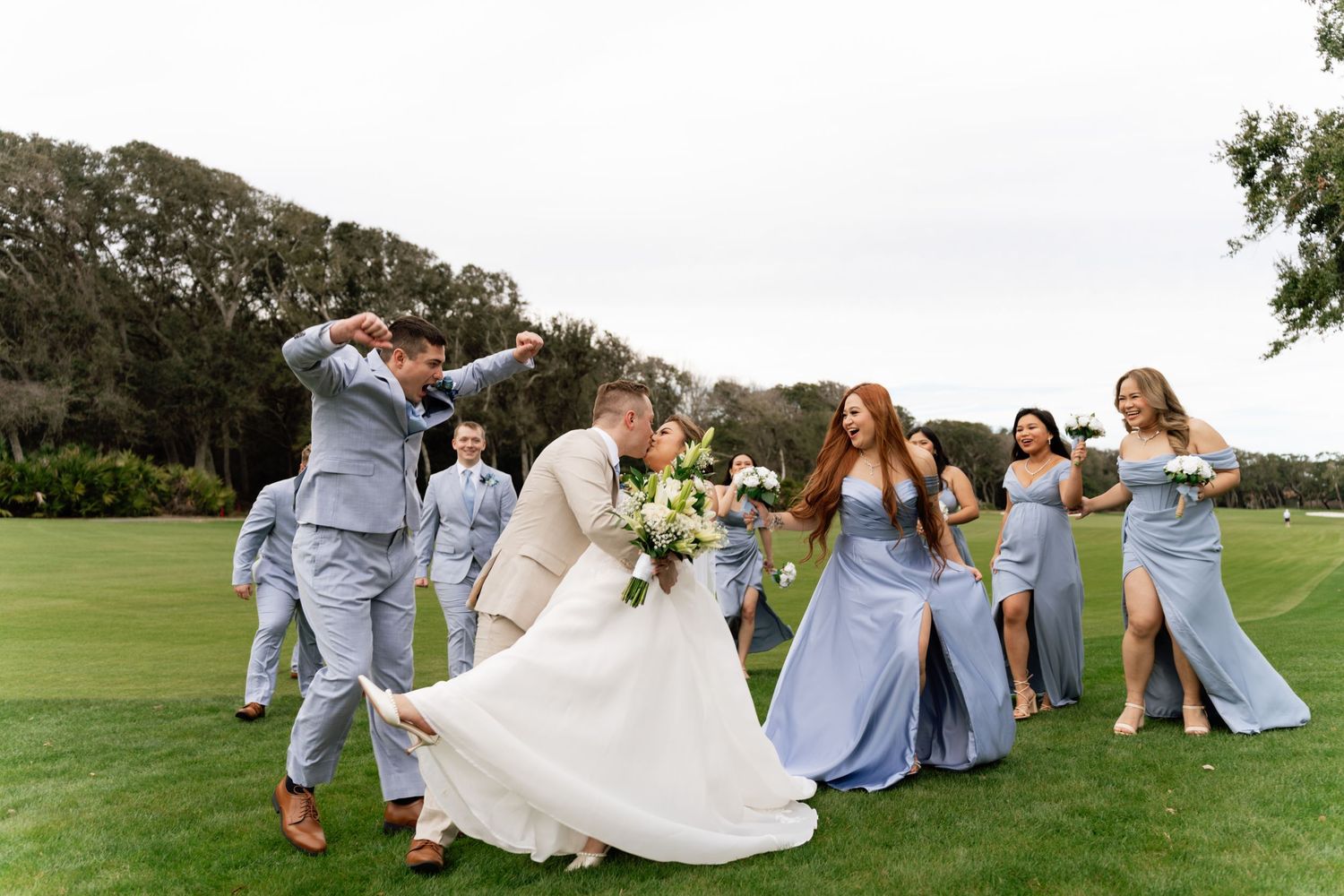 A sequence of wedding party photos shows playful moments on a green lawn with bridesmaids in light blue dresses.
