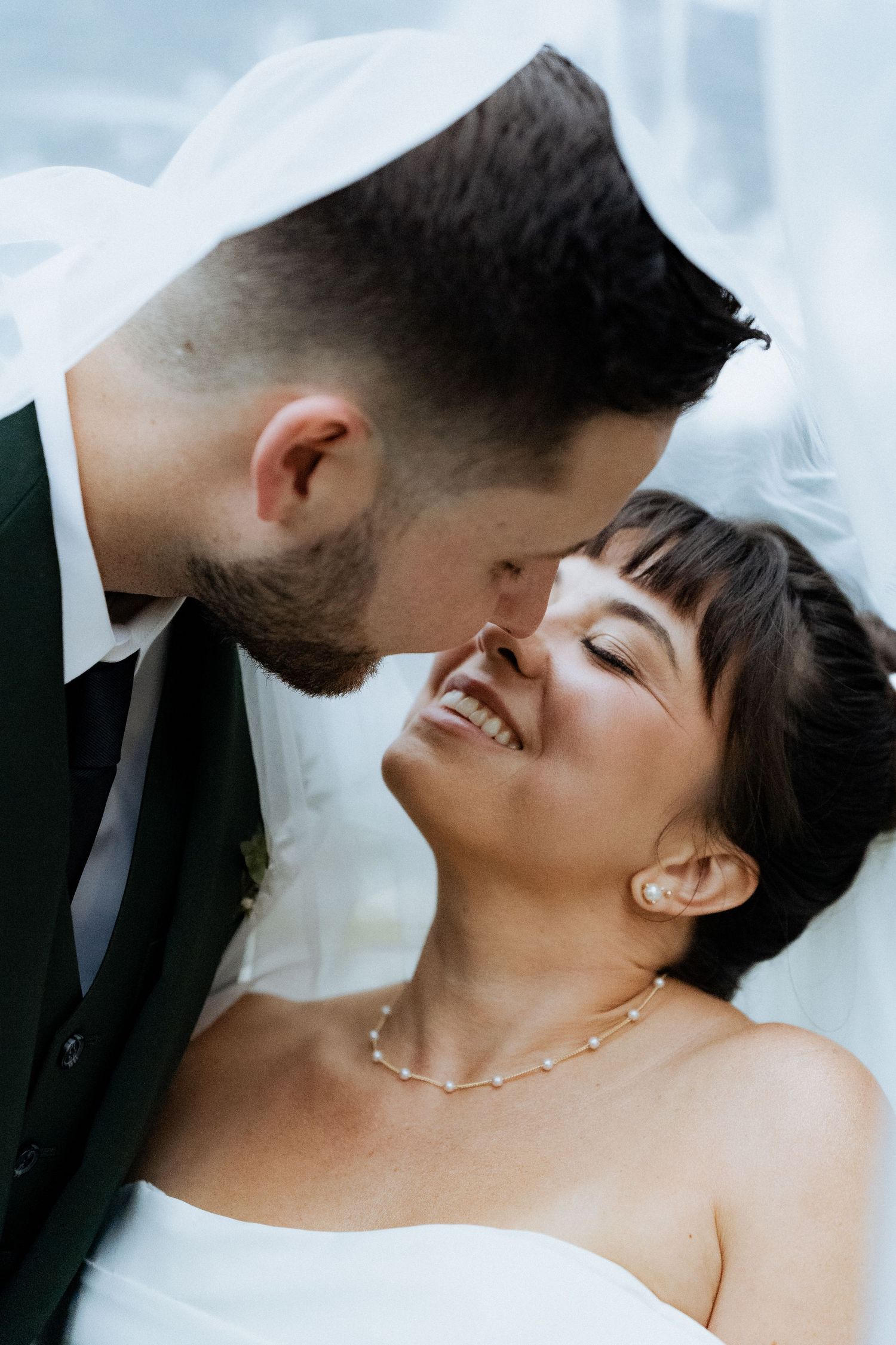A romantic series of wedding photos showing tender moments between newlyweds against a light background.