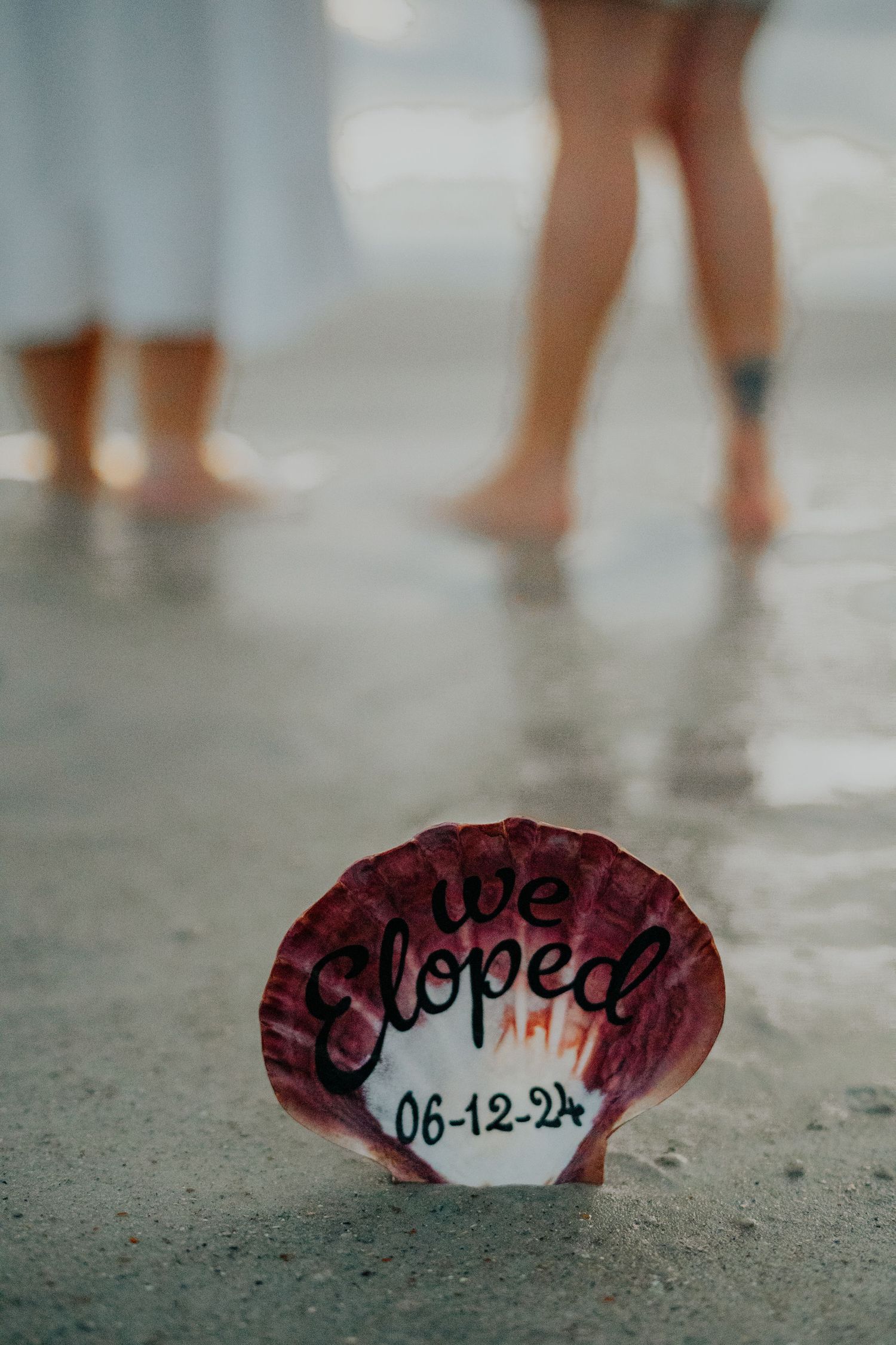Multiple images show a broken red and white ceramic piece with writing on it lying on a concrete surface.